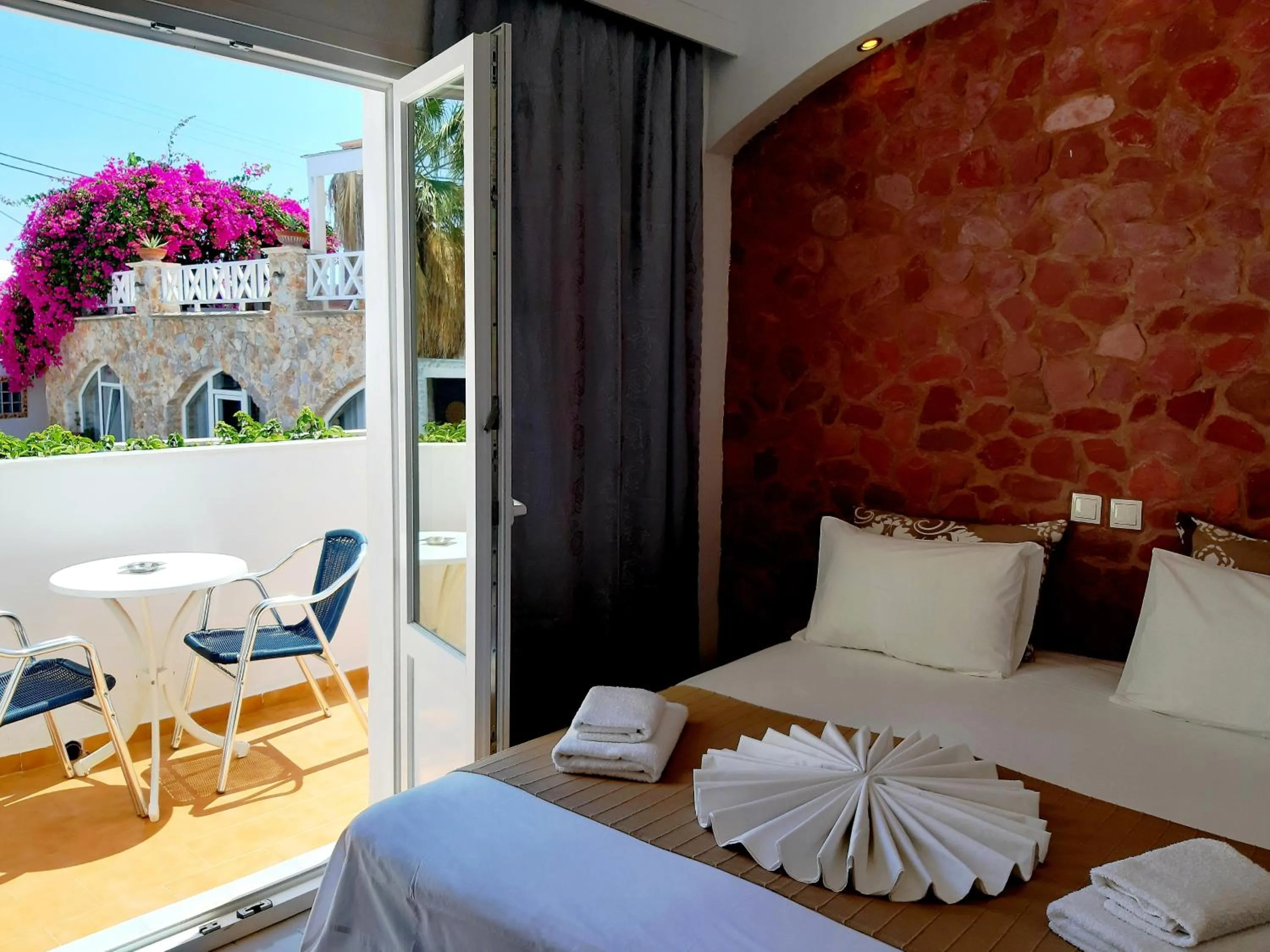 Bed in Atalos Suites