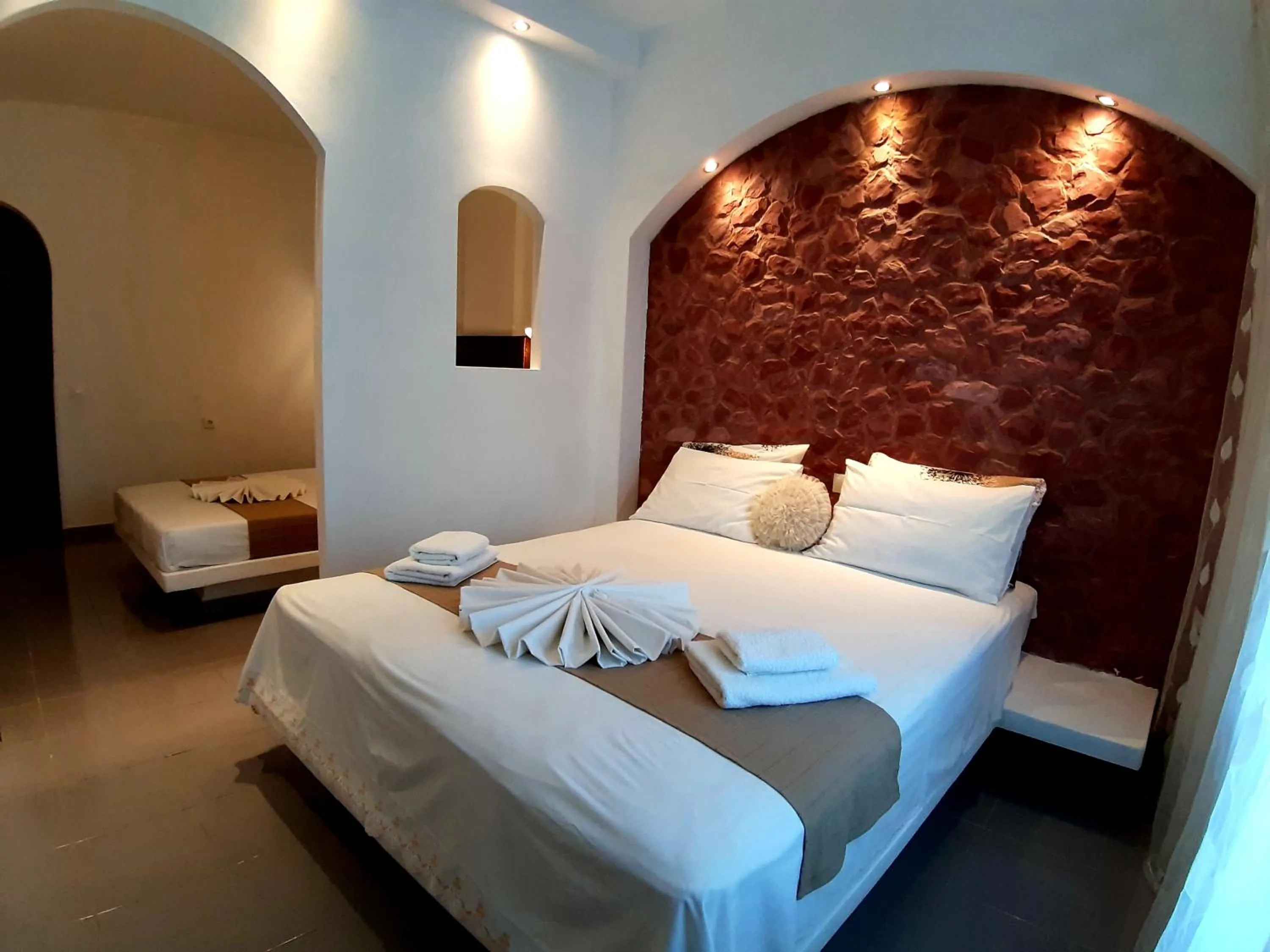 Bed in Atalos Suites