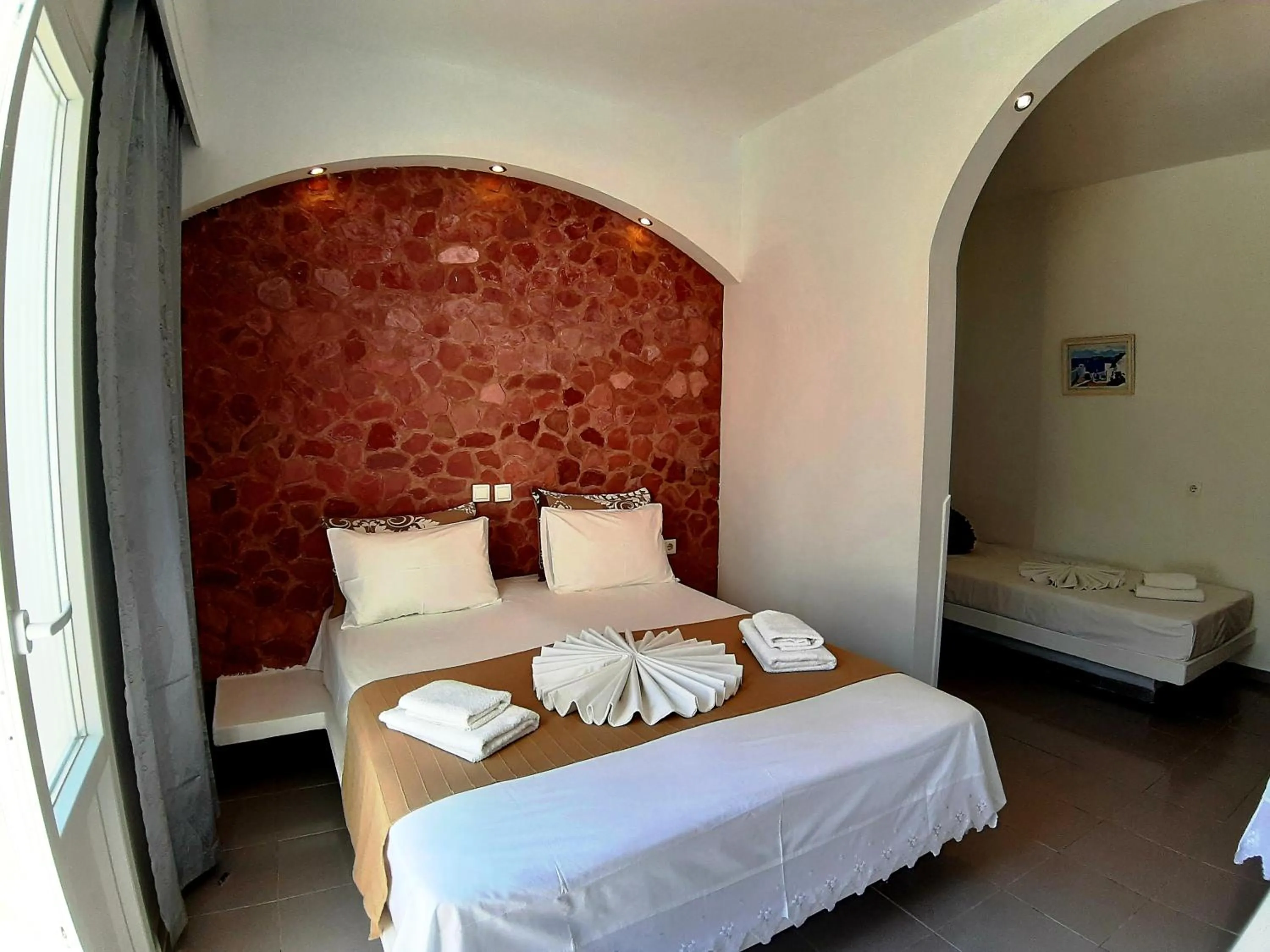 Bed in Atalos Suites