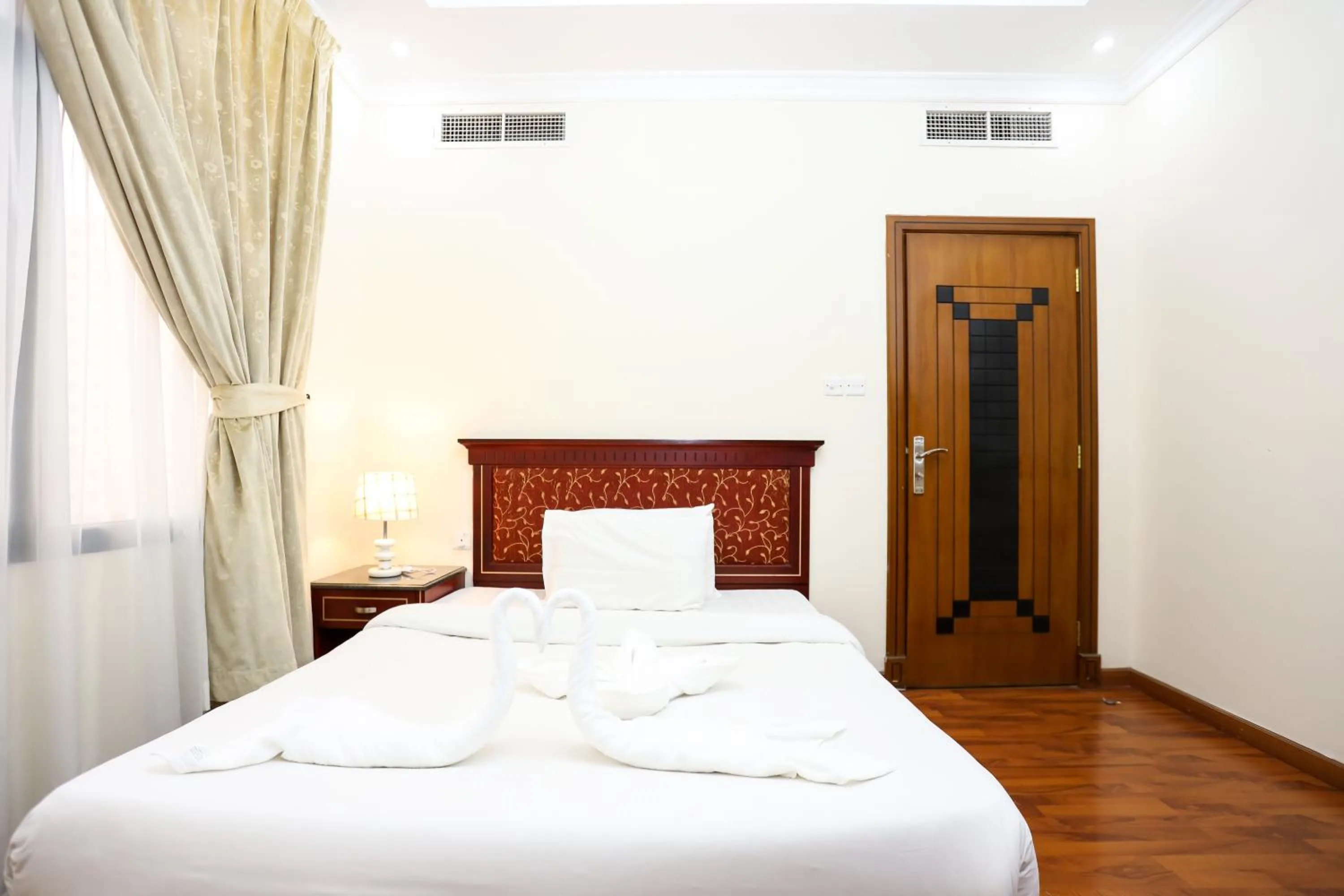 Bed in Pearl Bahrain Suites