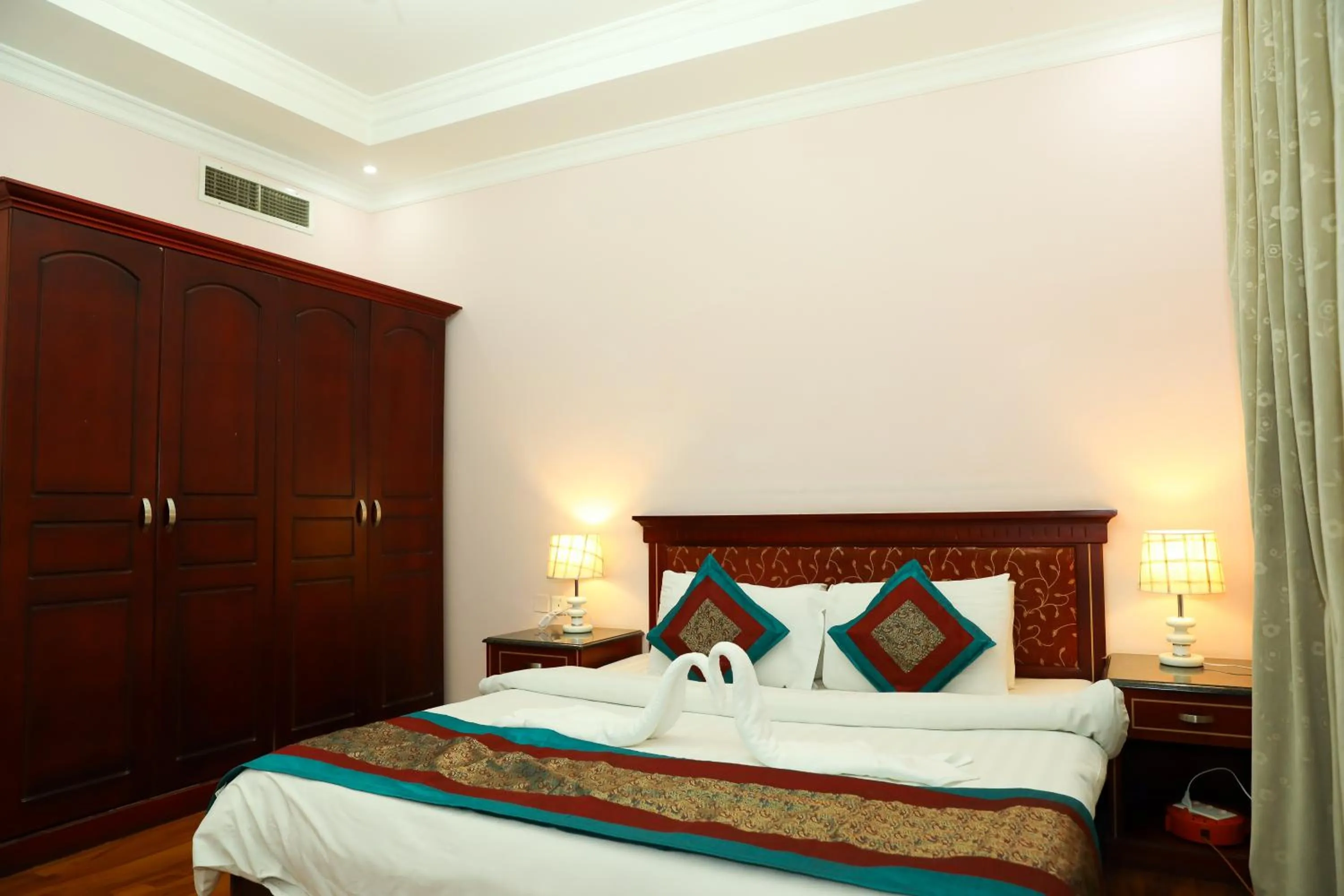 Bed in Pearl Bahrain Suites