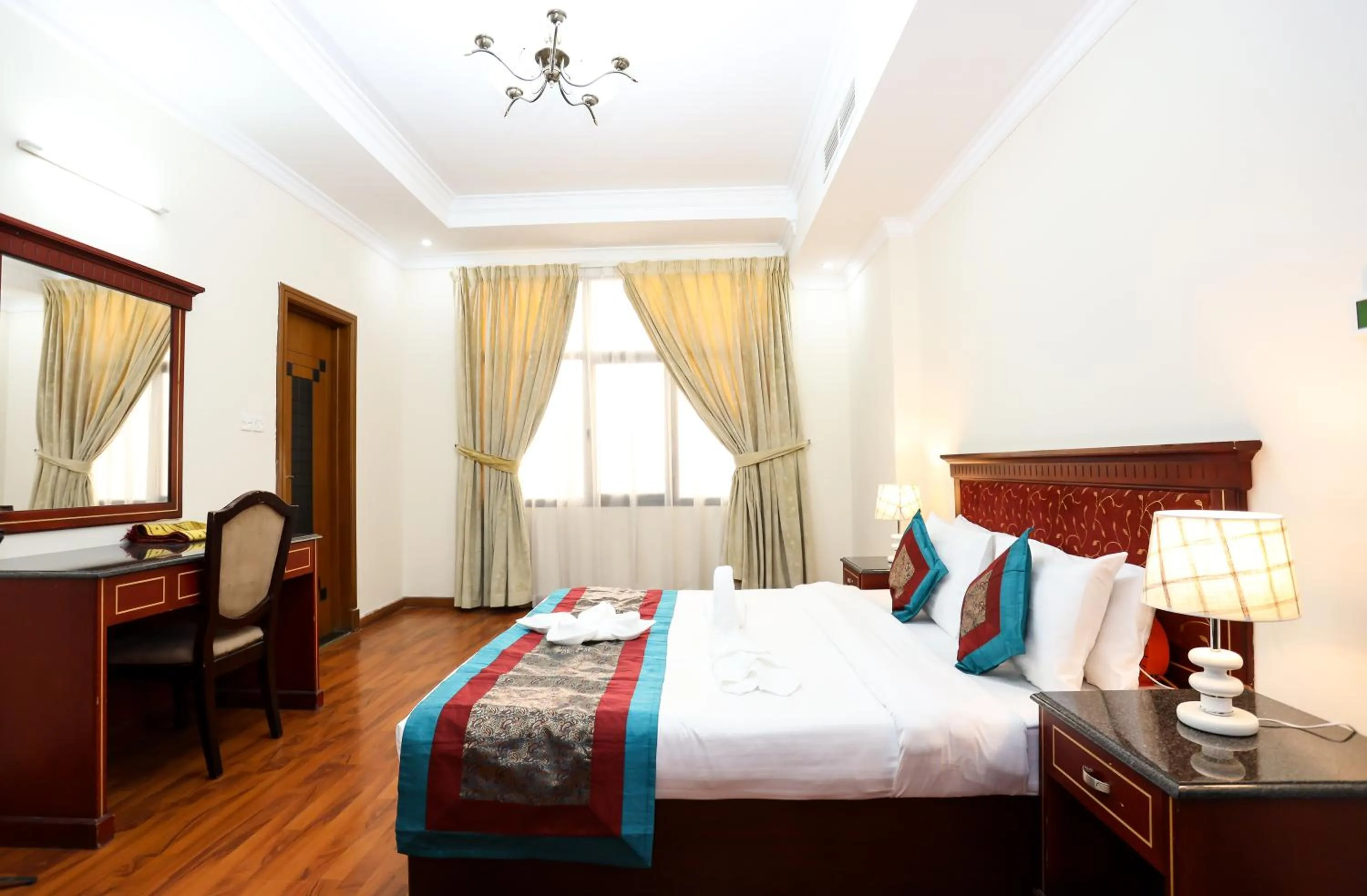 Bed in Pearl Bahrain Suites