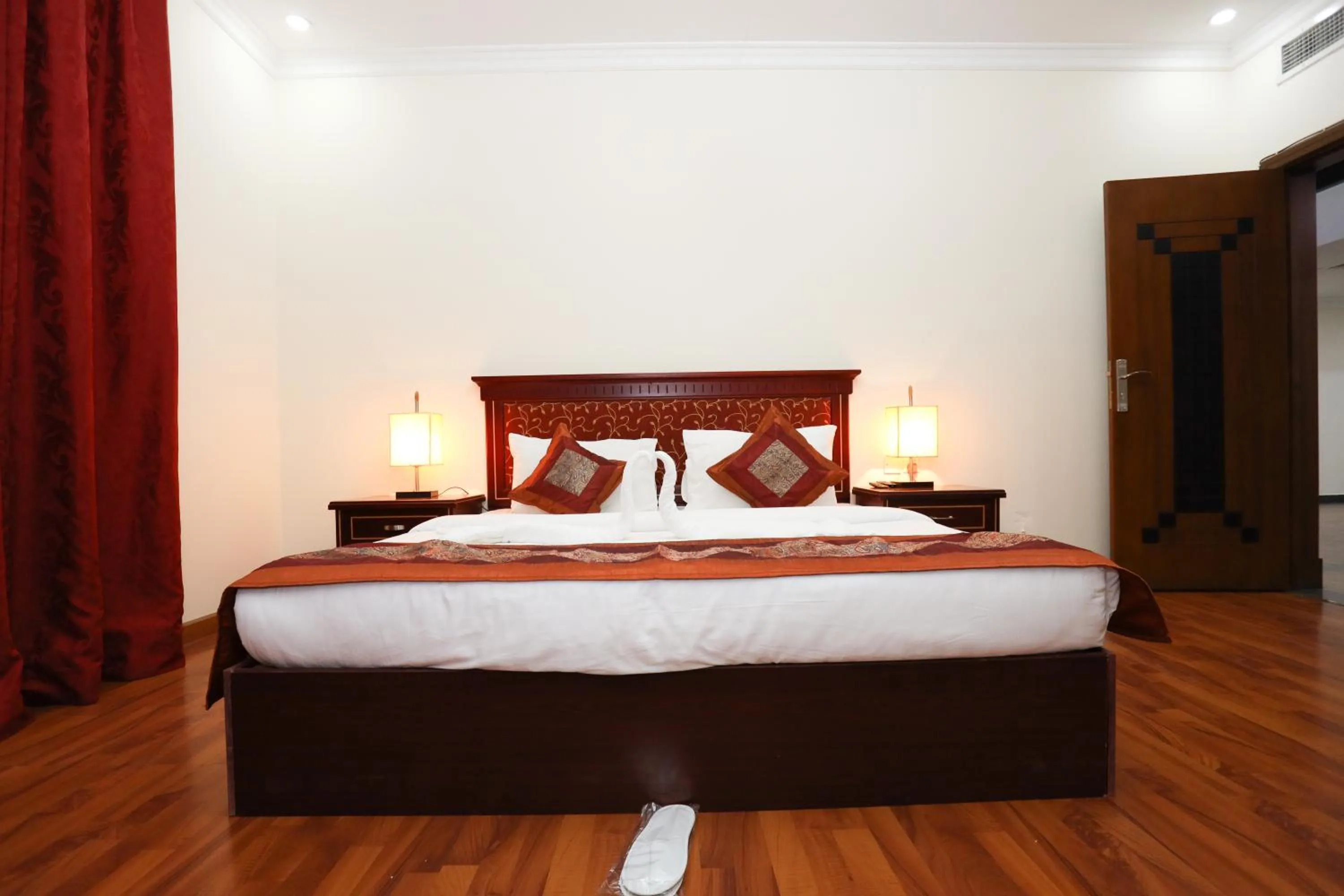 Bed in Pearl Bahrain Suites