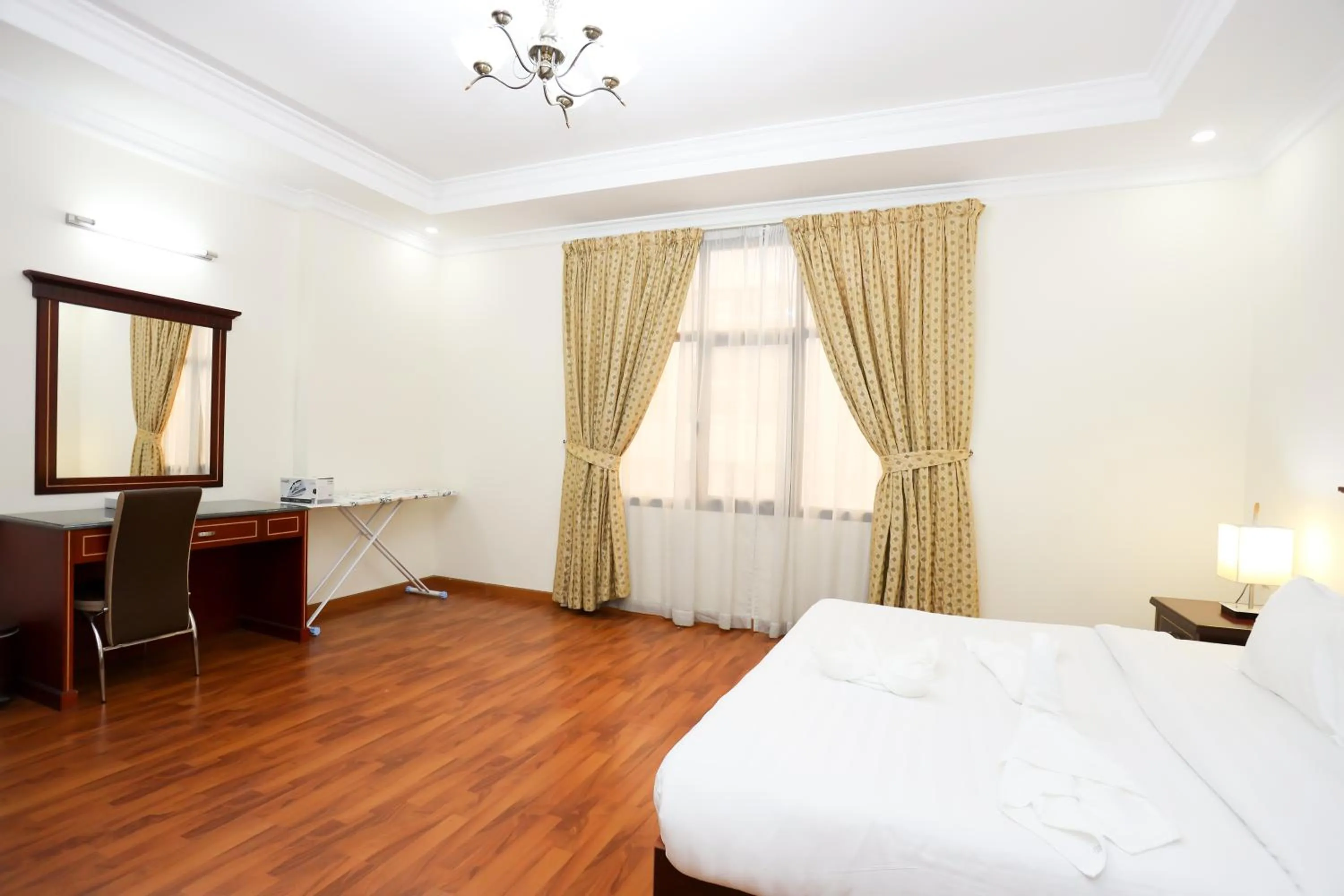 Bed in Pearl Bahrain Suites