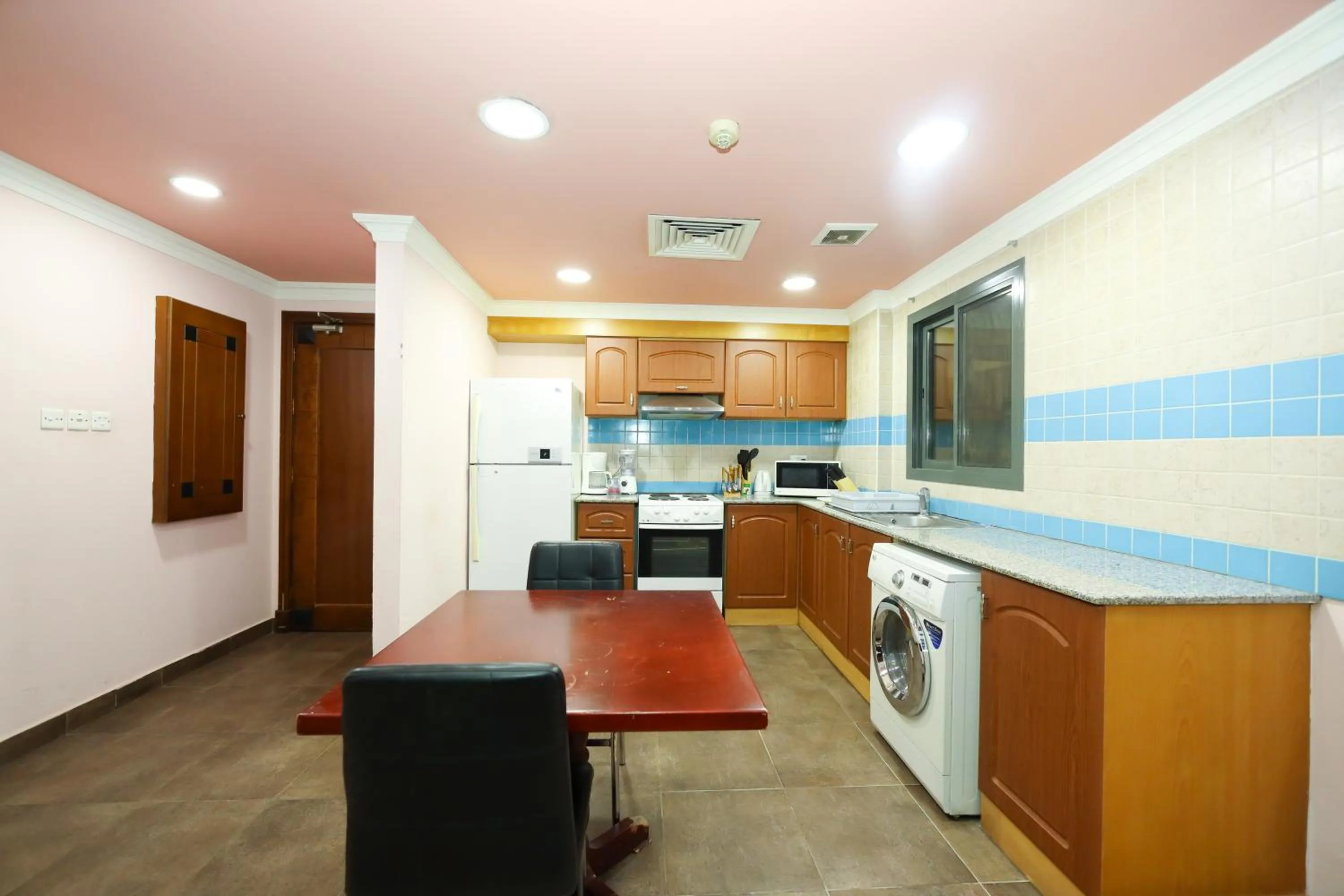 Kitchen or kitchenette in Pearl Bahrain Suites