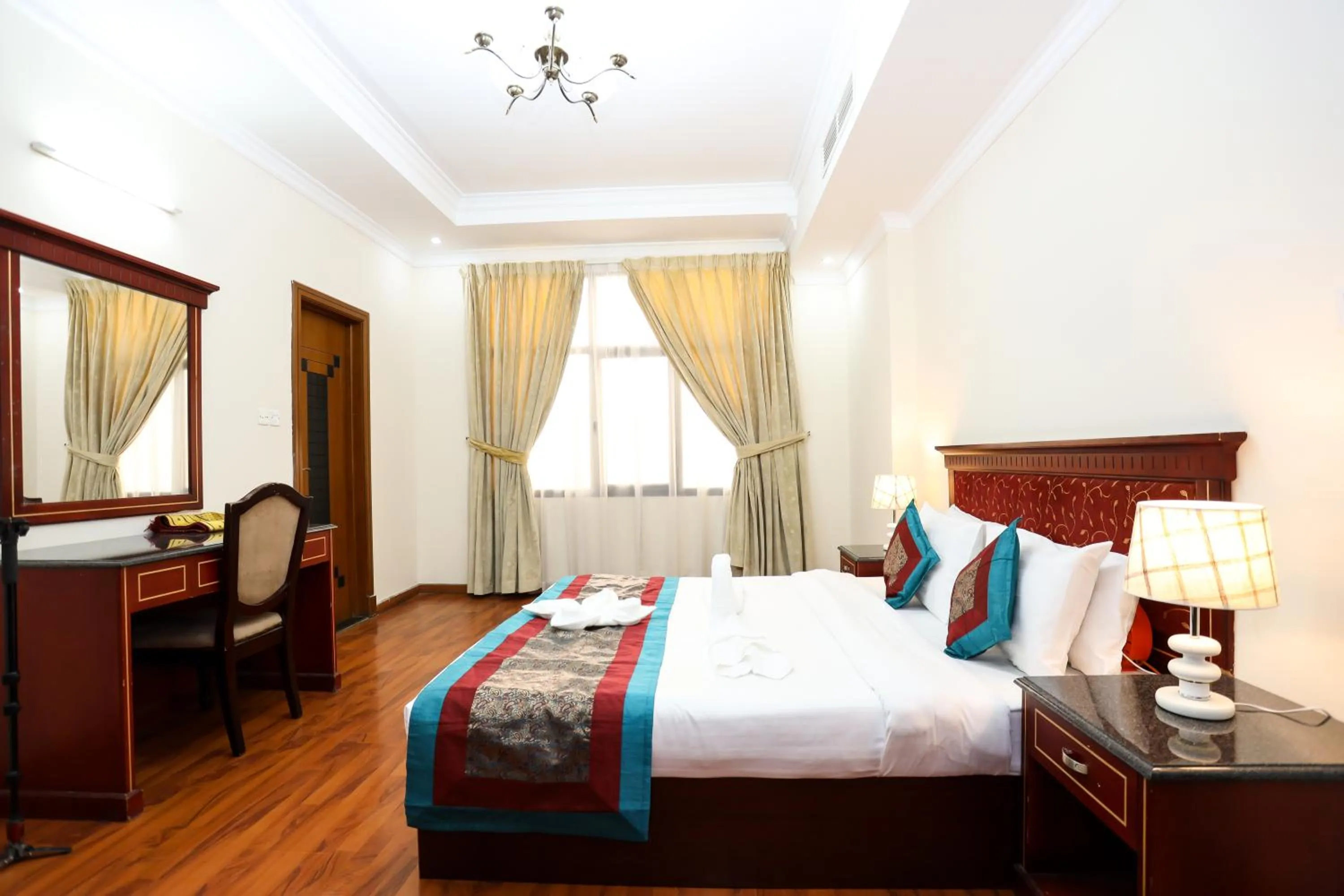 Bed in Pearl Bahrain Suites