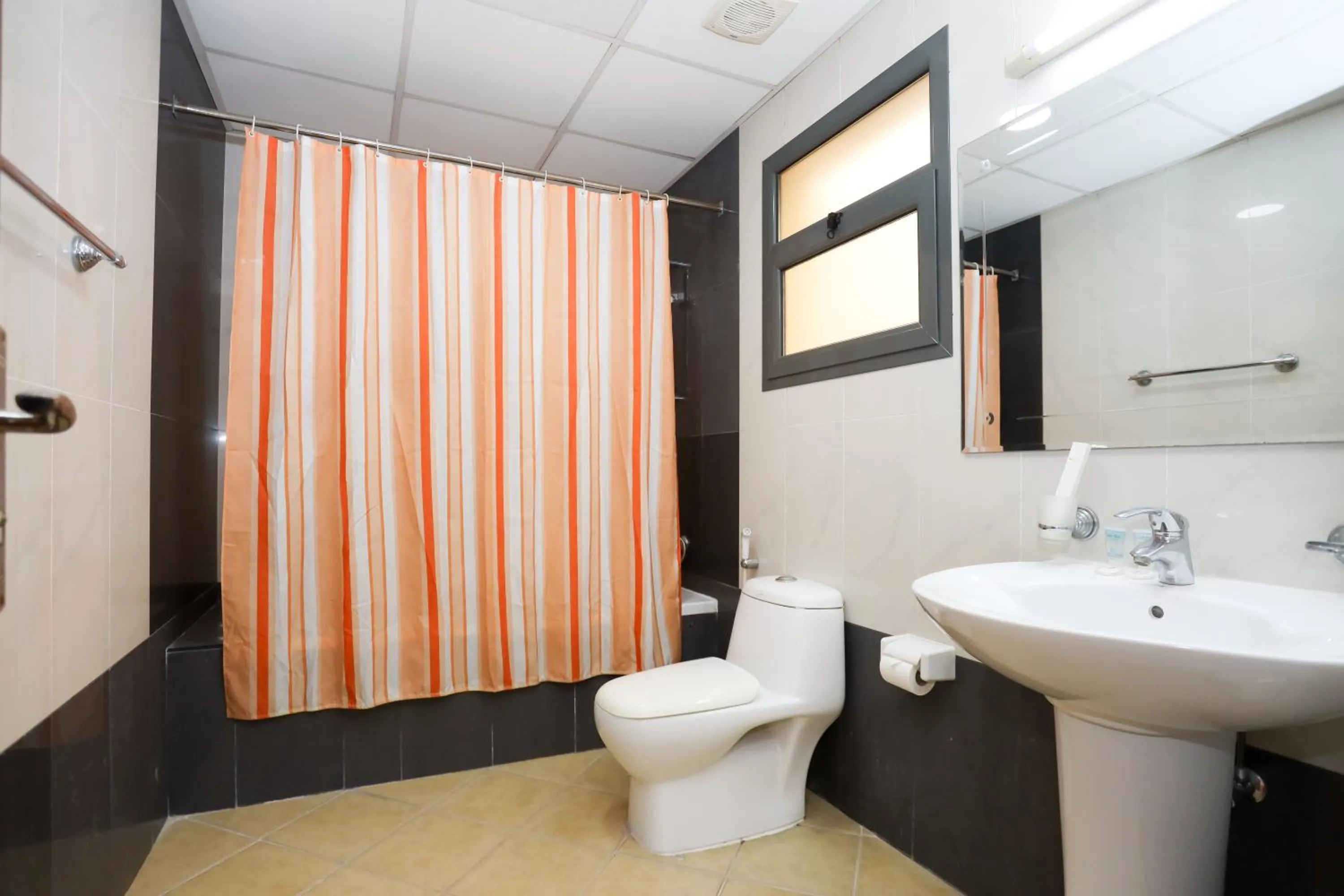 Toilet in Pearl Bahrain Suites