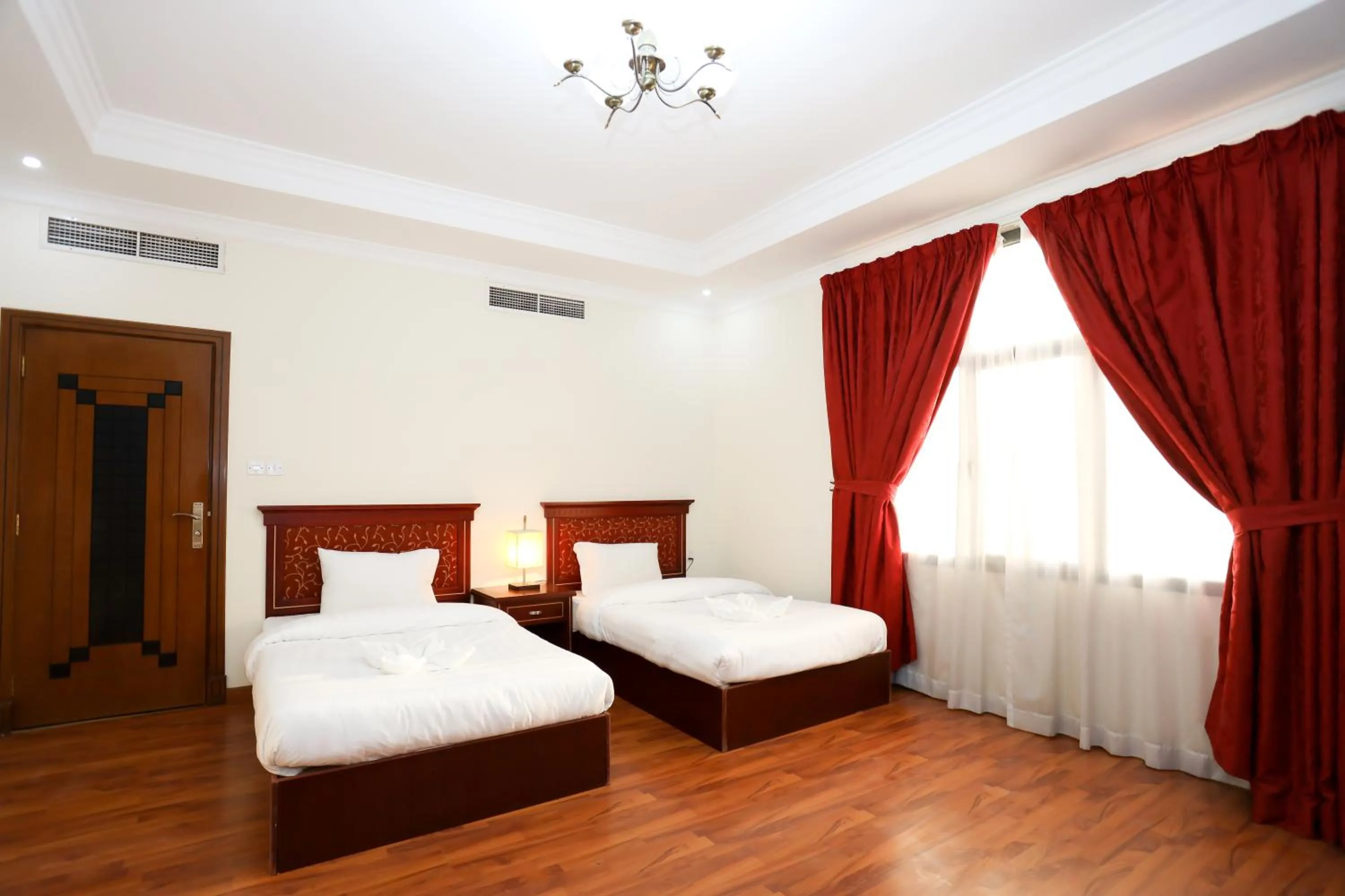 Bed in Pearl Bahrain Suites