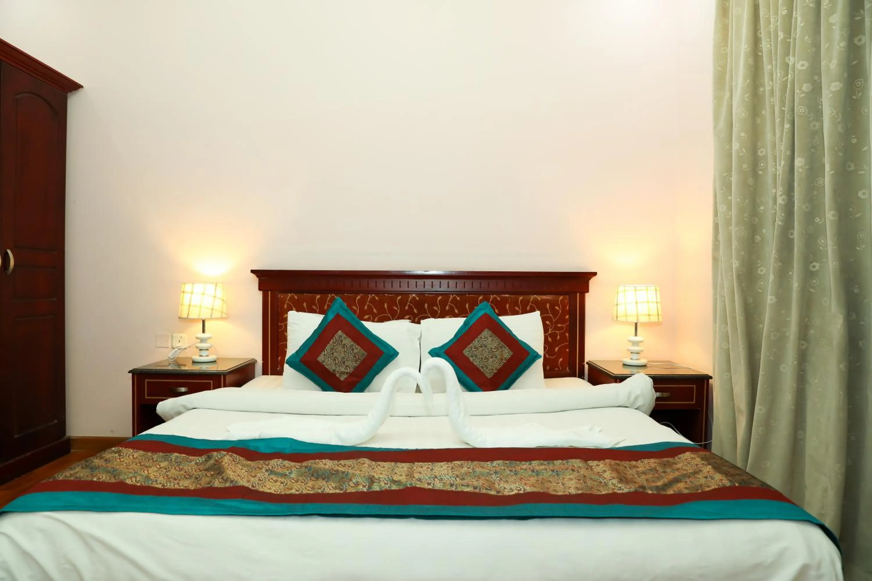 Bed in Pearl Bahrain Suites