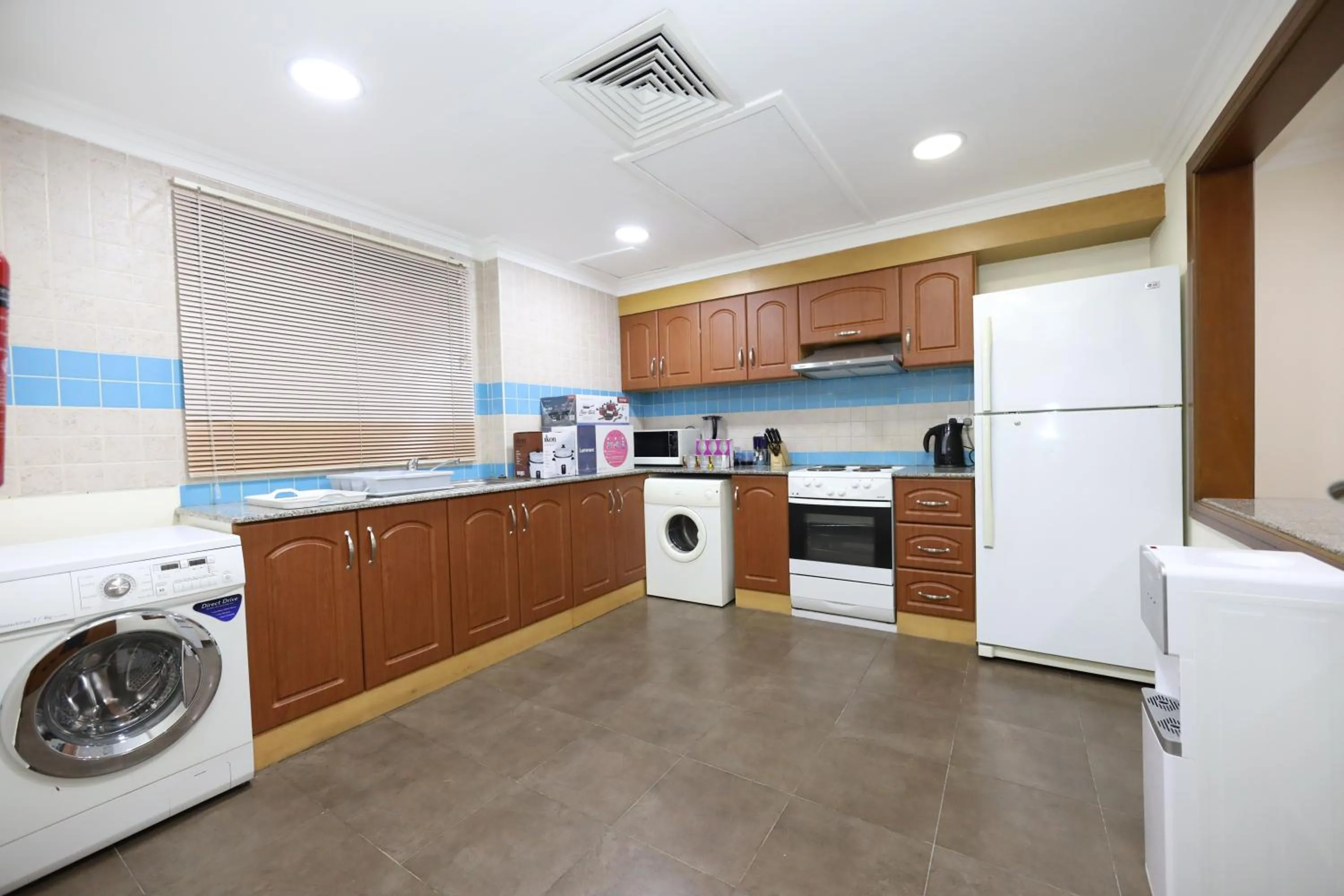 Kitchen or kitchenette in Pearl Bahrain Suites