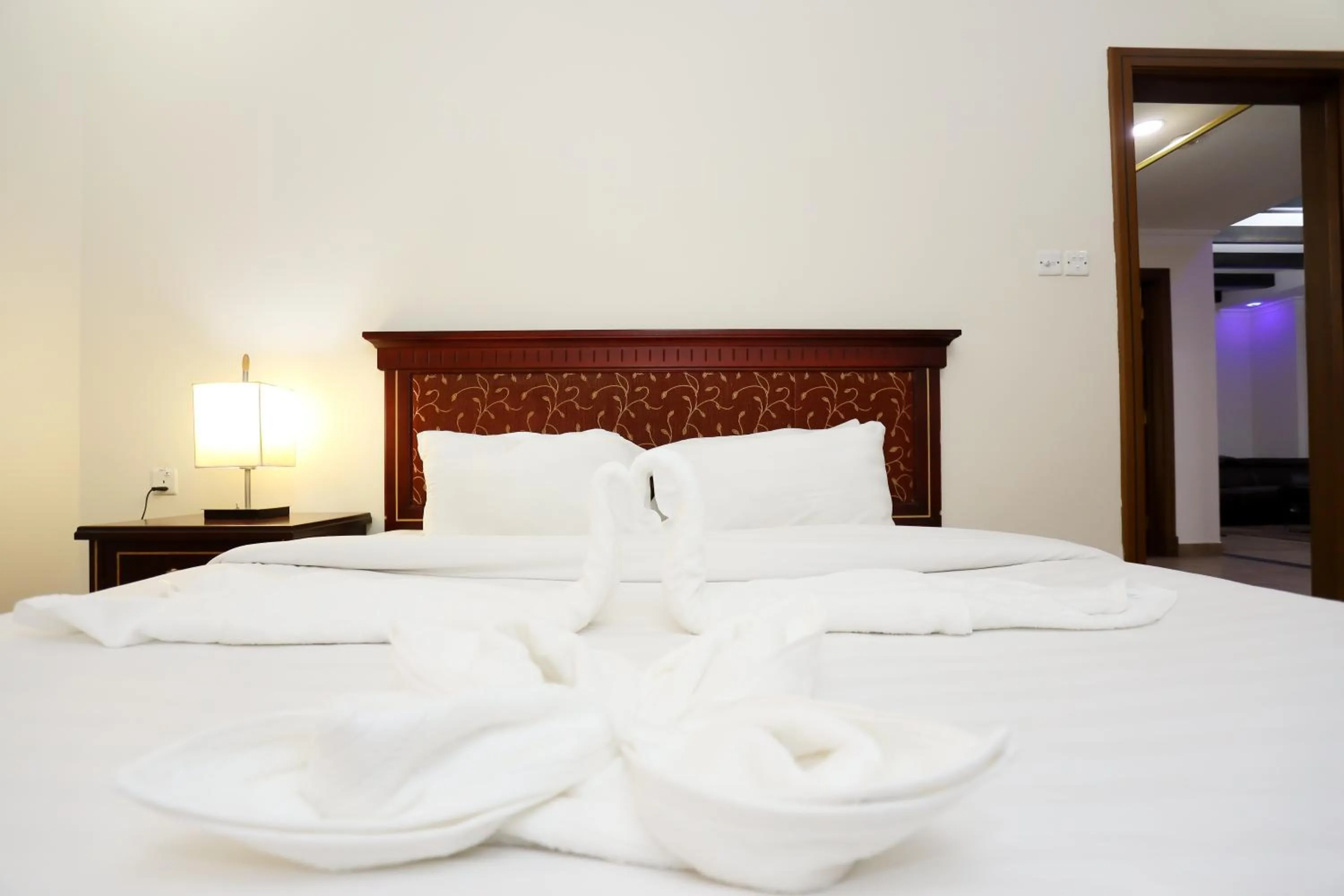 Bed in Pearl Bahrain Suites