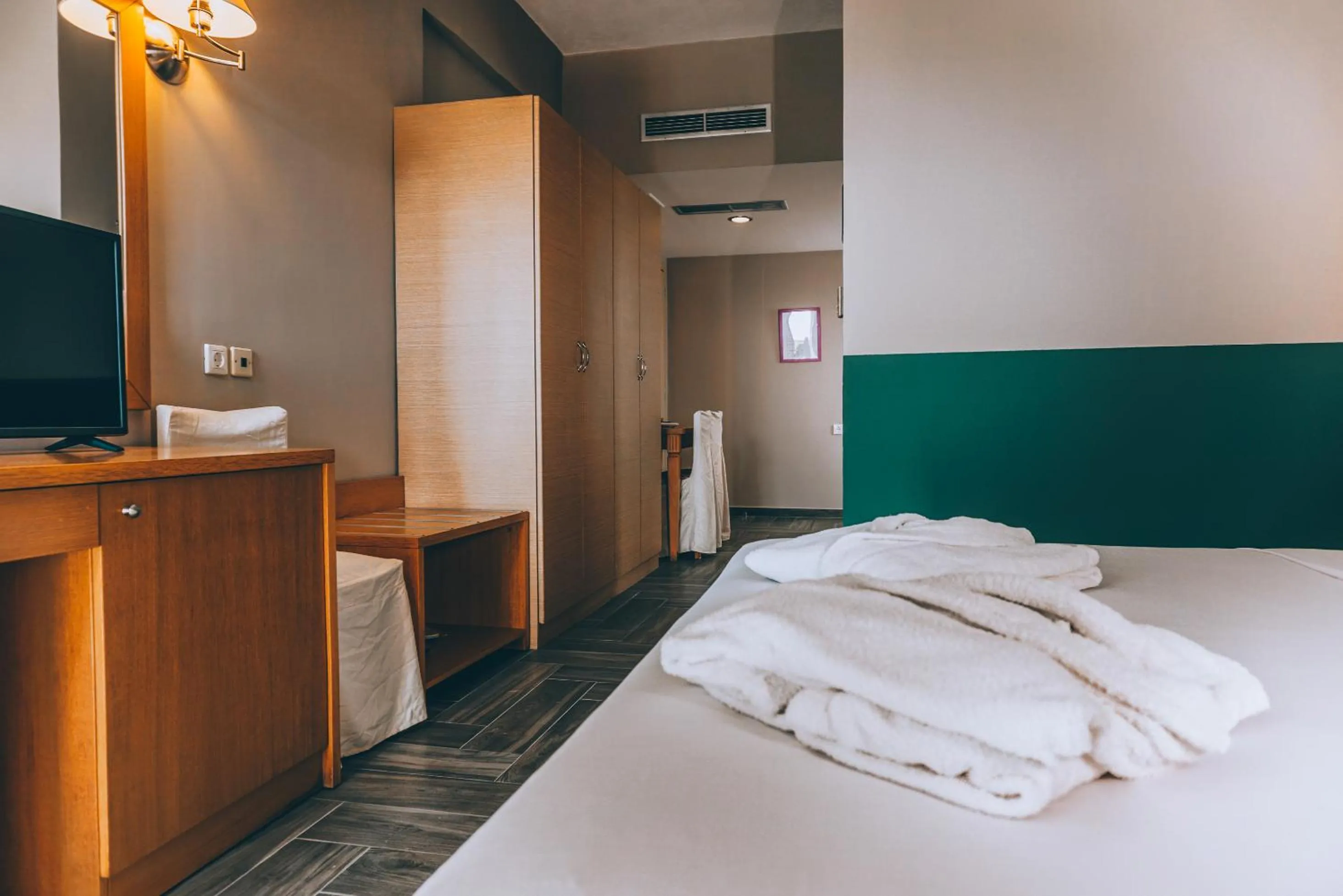 Bed in Apollo Resort Art Hotel