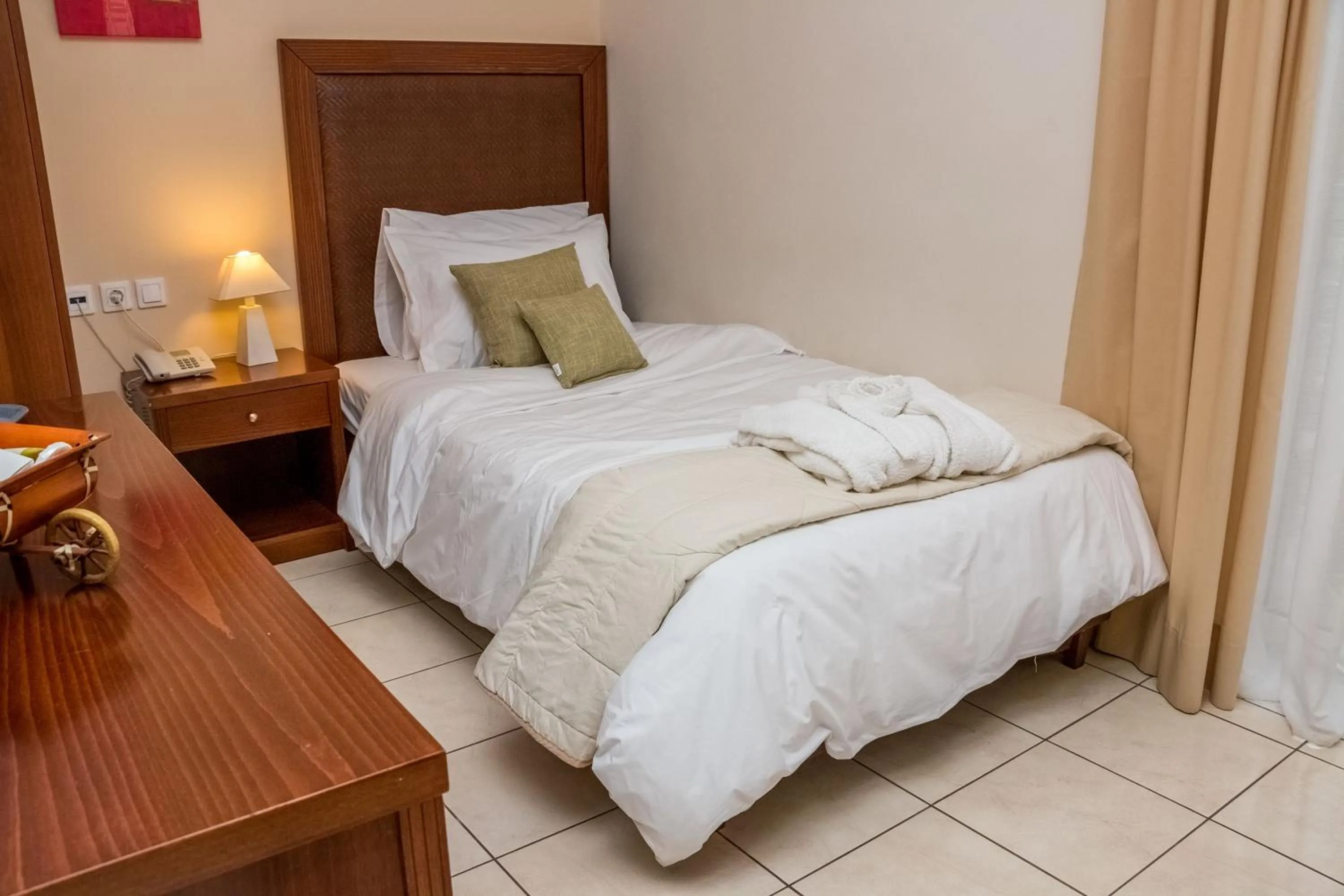 Bed in Apollo Resort Art Hotel