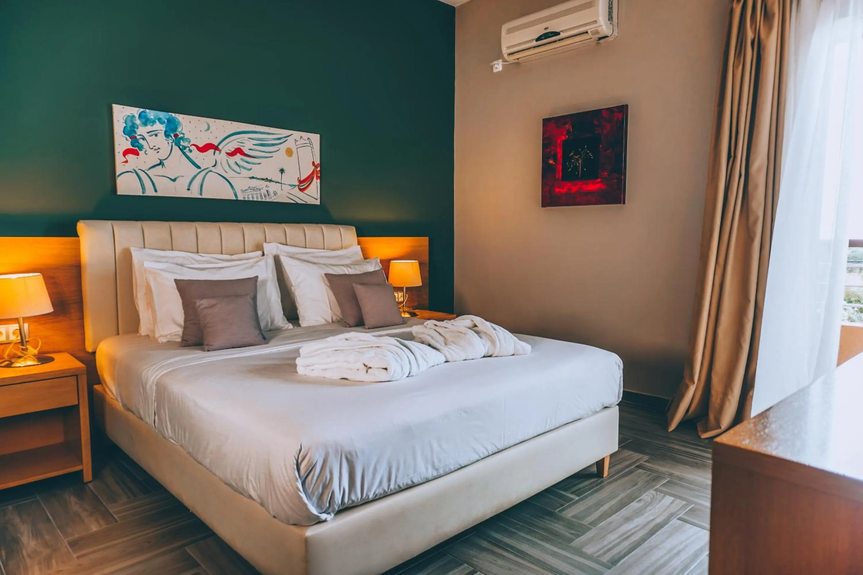 Bed in Apollo Resort Art Hotel