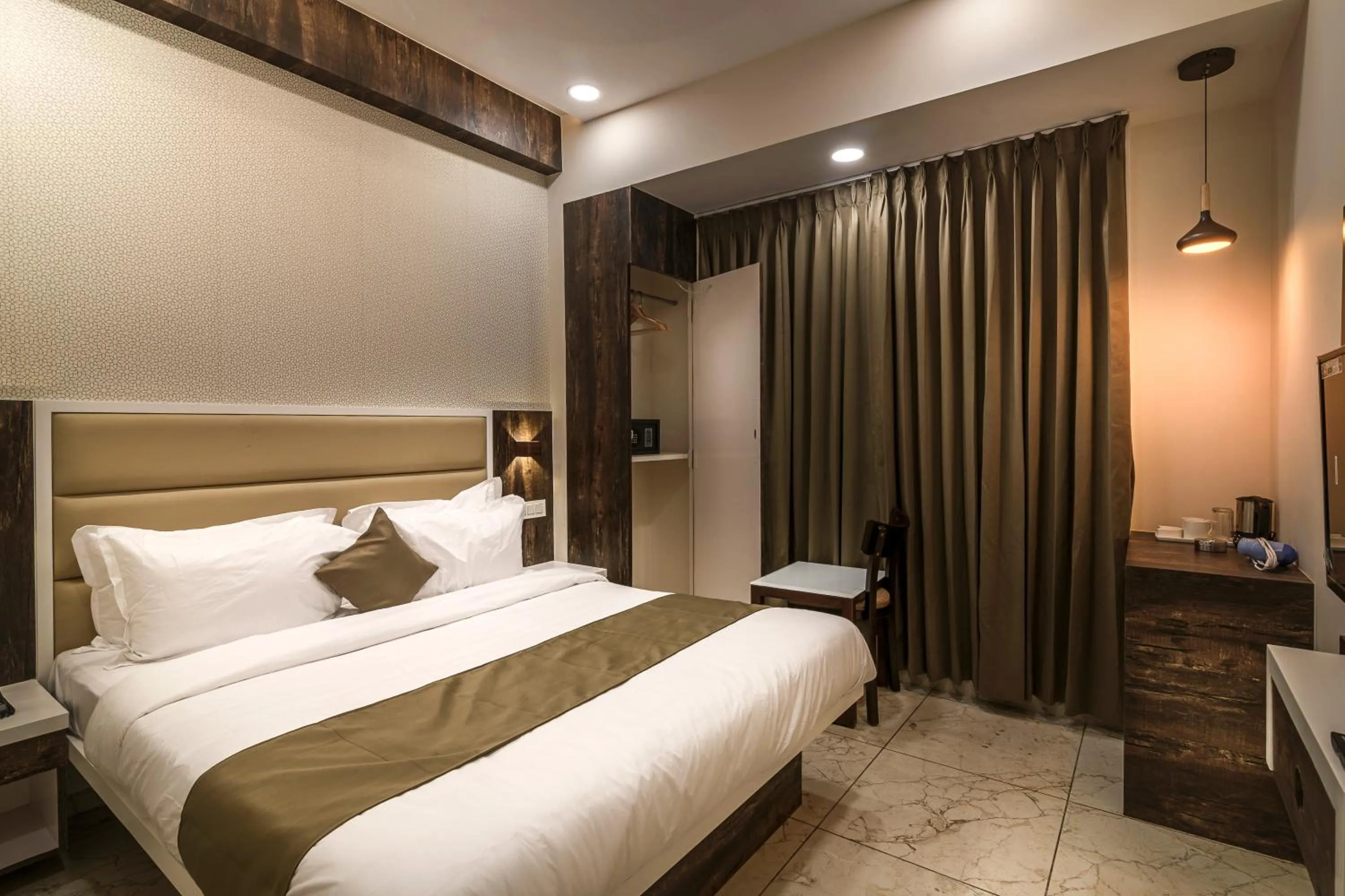 Bed in Hotel Royal Treat Surat