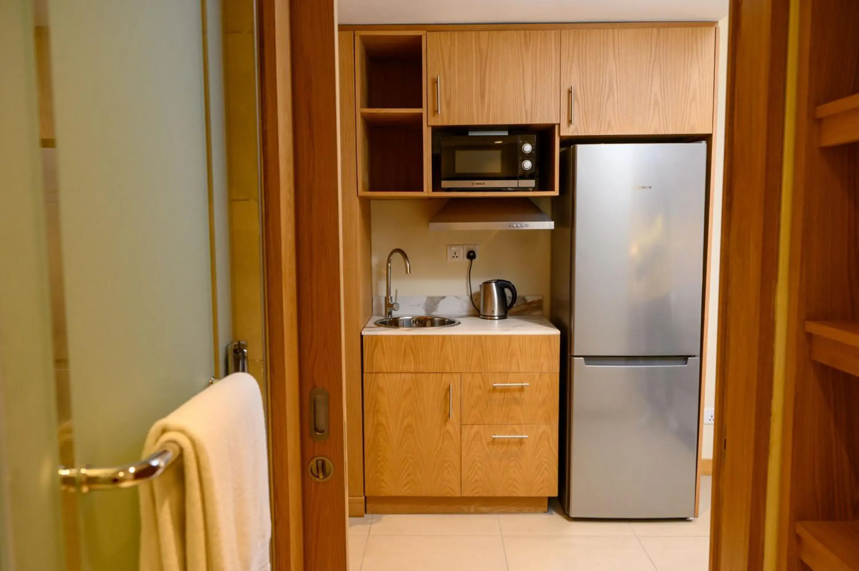 Family Room with Kitchenette - River Facing in Ocean's Creek Beach Hotel Family Room with Kitchenette - River Facing in Ocean's Creek Beach Hotel