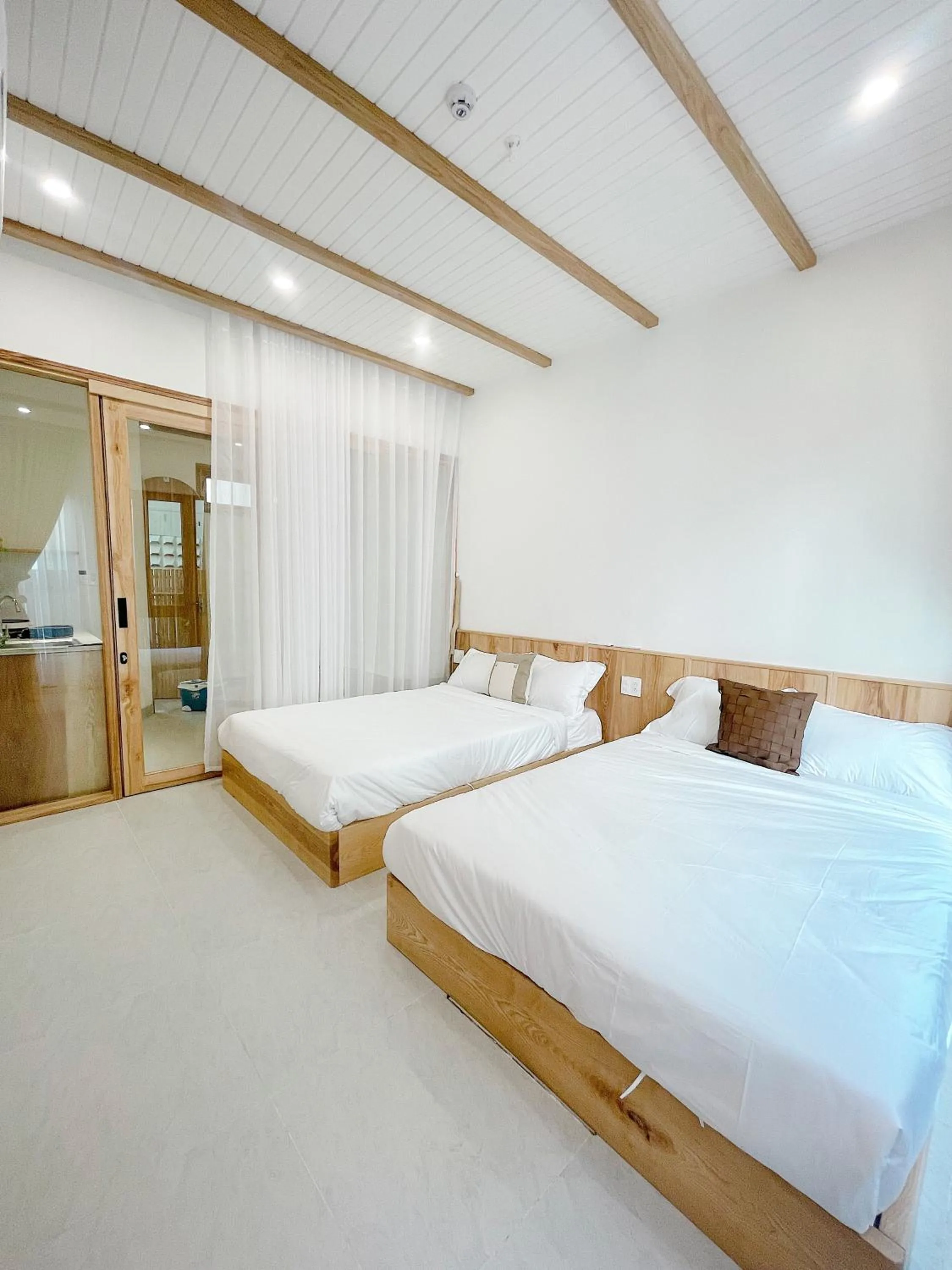 Bedroom, Bed in Baphu Beachwalk Apartment - 5 min walk to My Khe beach