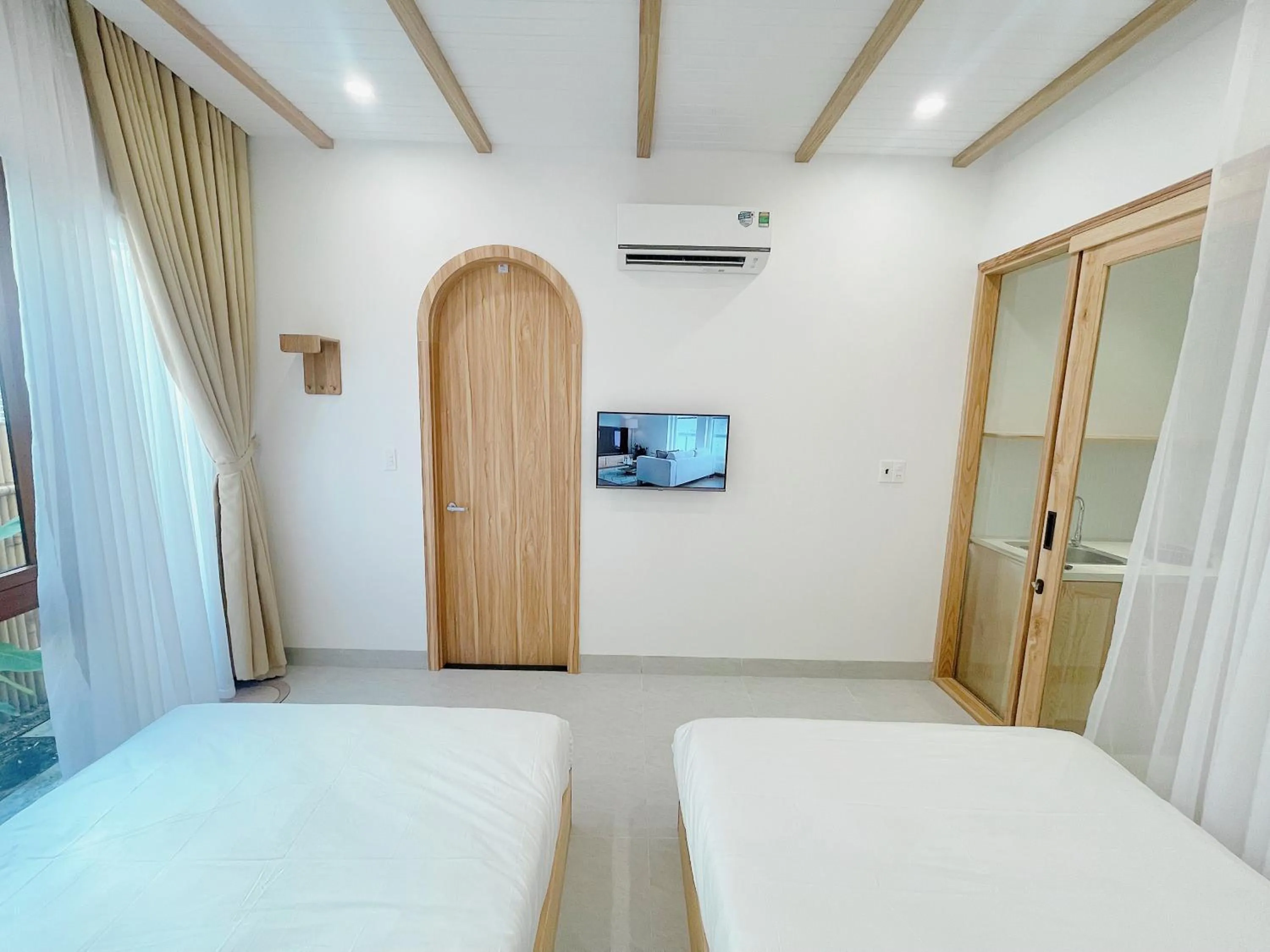 Bedroom, Bed in Baphu Beachwalk Apartment - 5 min walk to My Khe beach