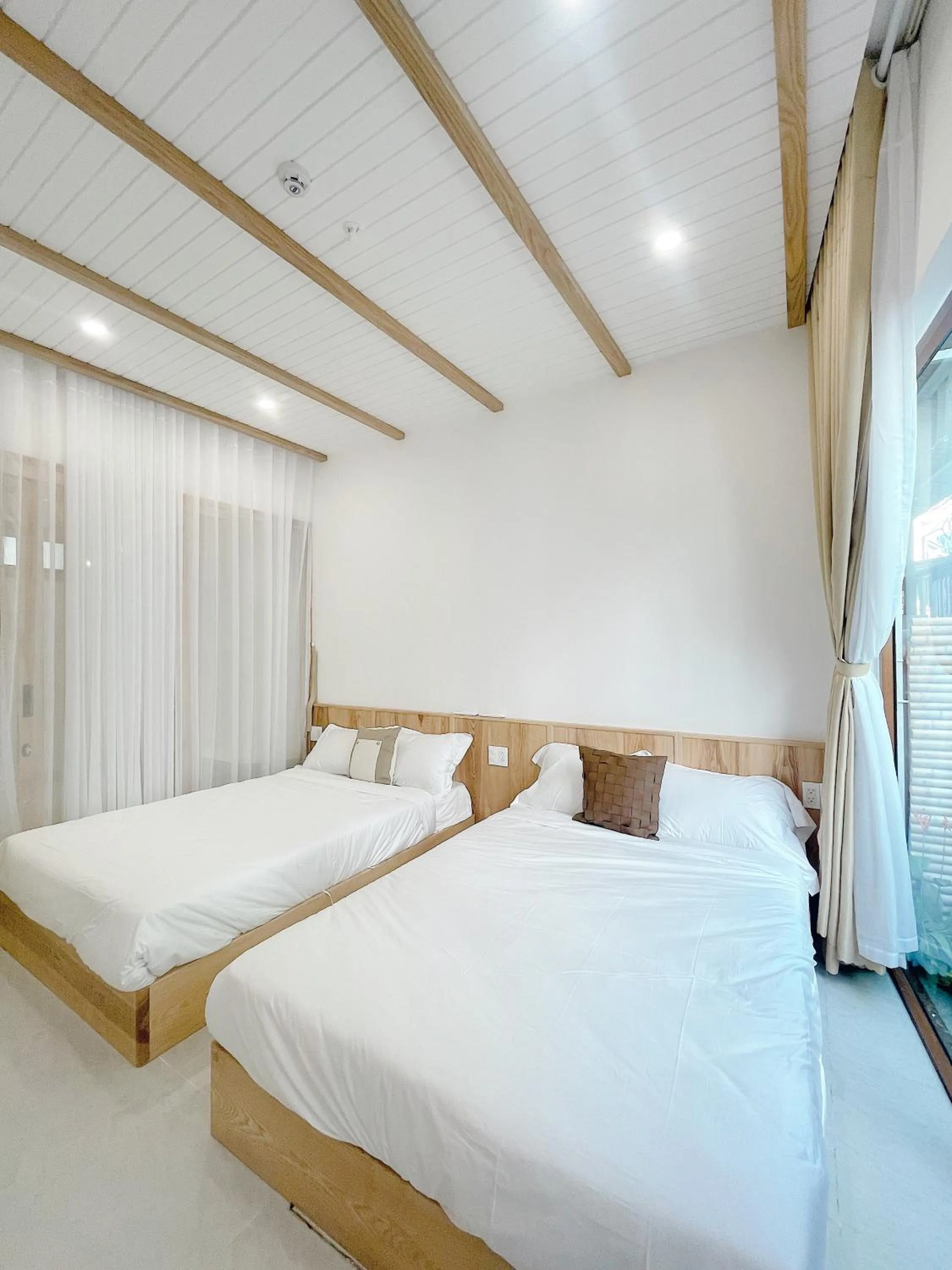 Bedroom, Bed in Baphu Beachwalk Apartment - 5 min walk to My Khe beach