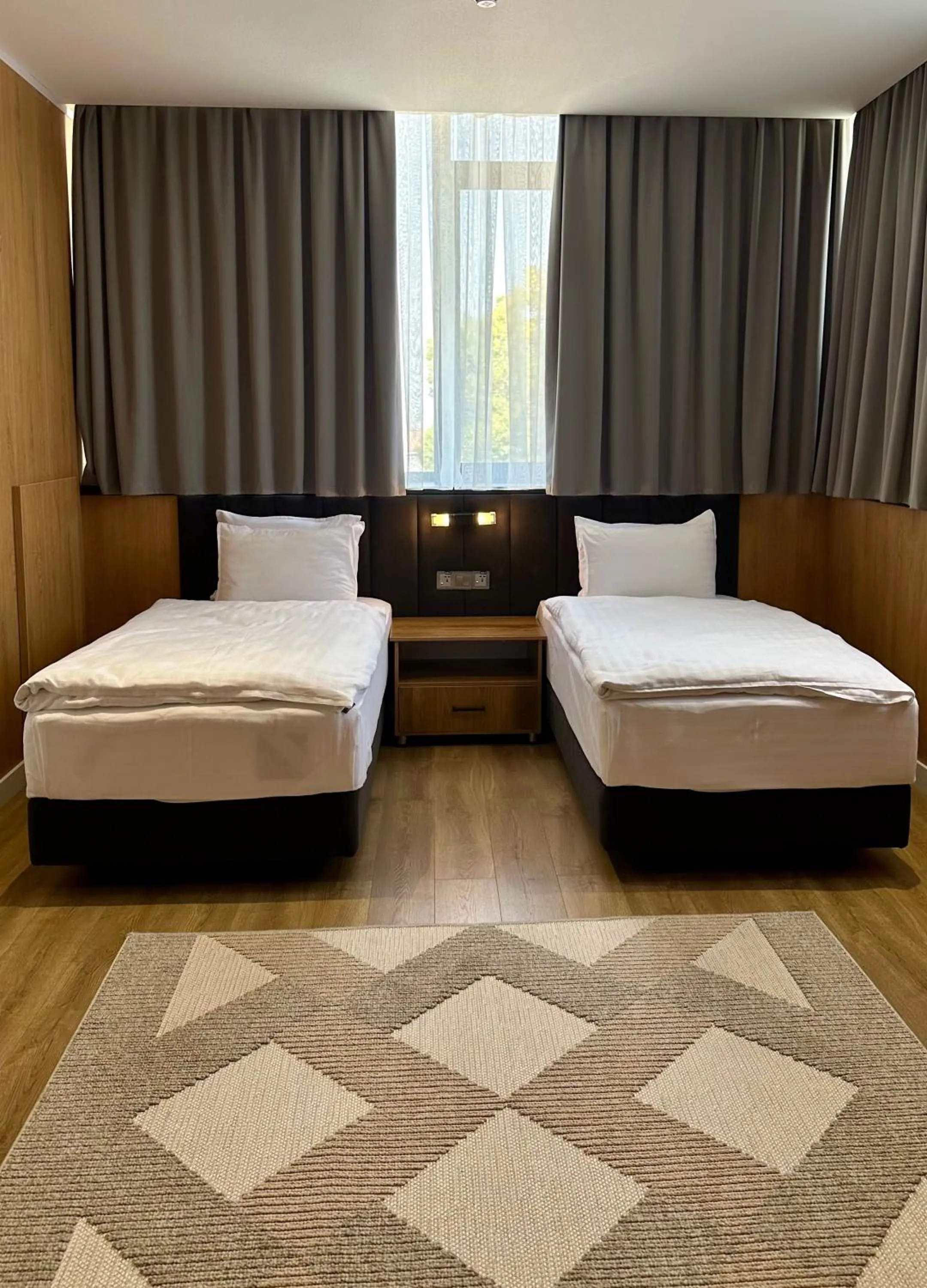 Bed in WELLFORT HOTEL