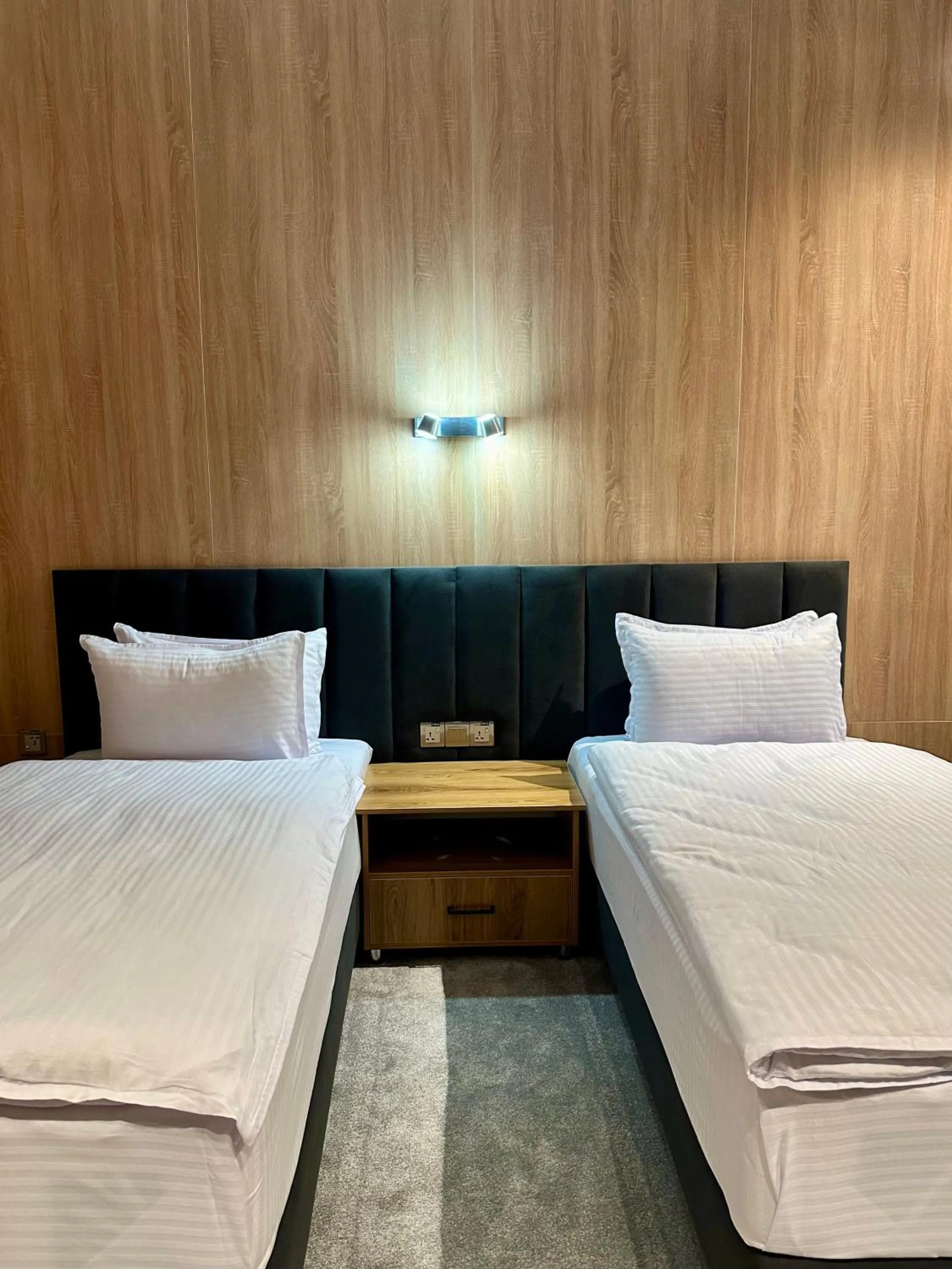 Bed in WELLFORT HOTEL