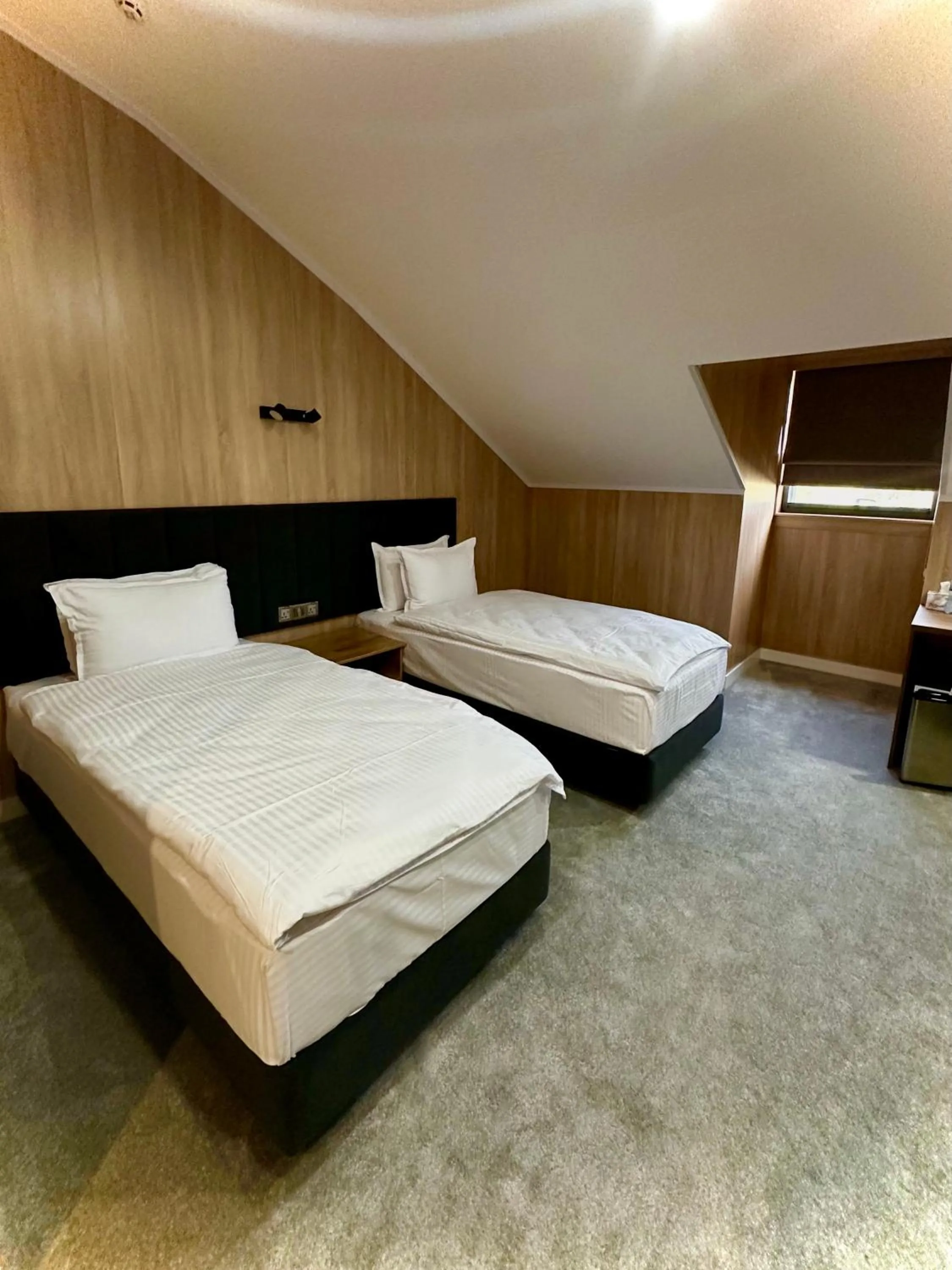 Bed in WELLFORT HOTEL