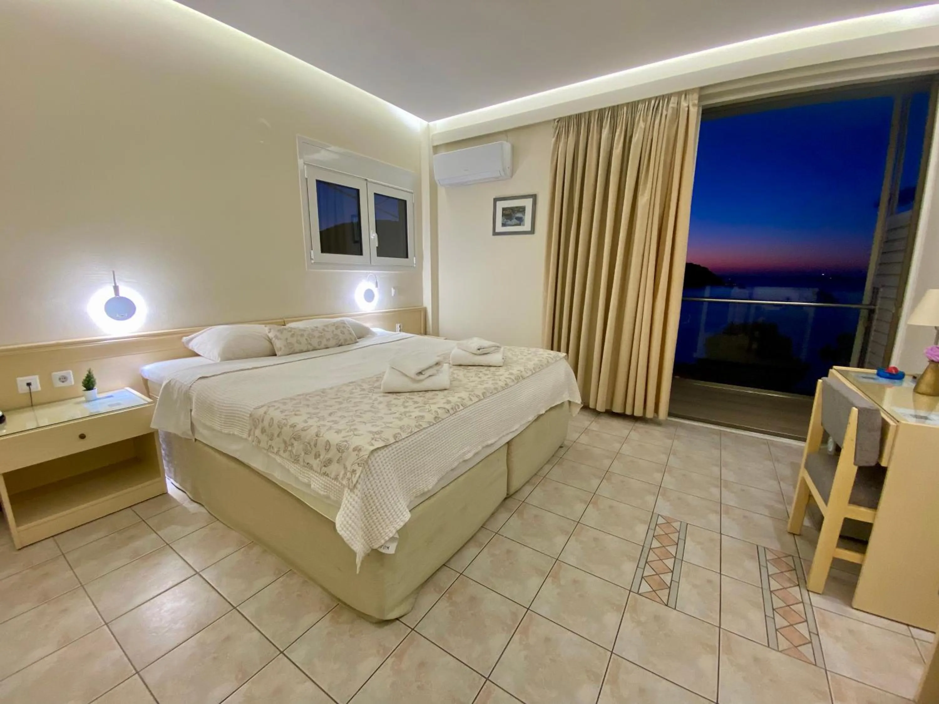 Bed in New Aegli Resort Hotel