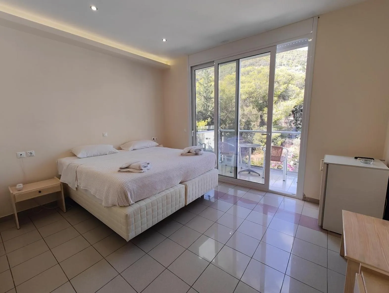 Bed in New Aegli Resort Hotel