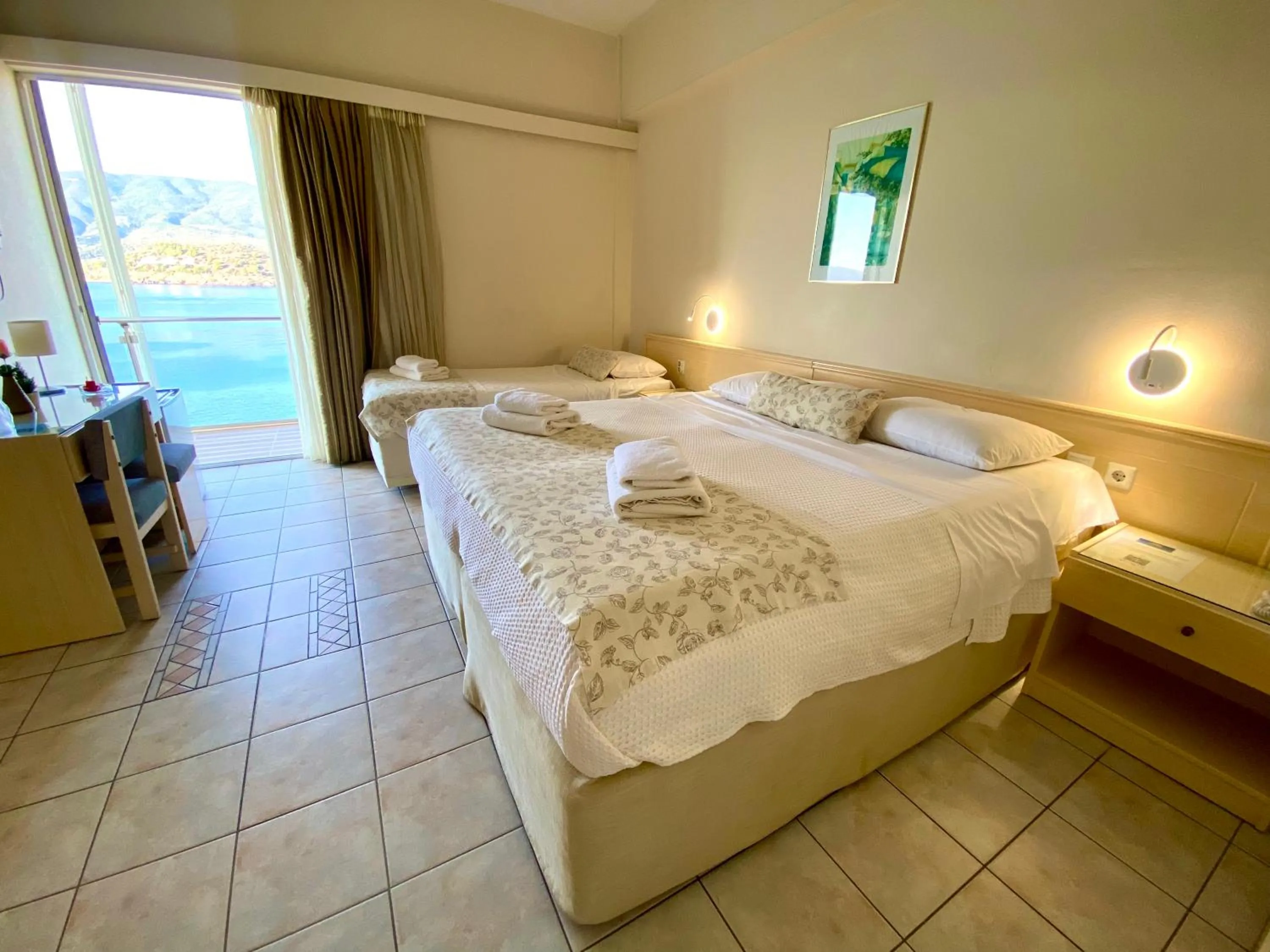 Bed in New Aegli Resort Hotel