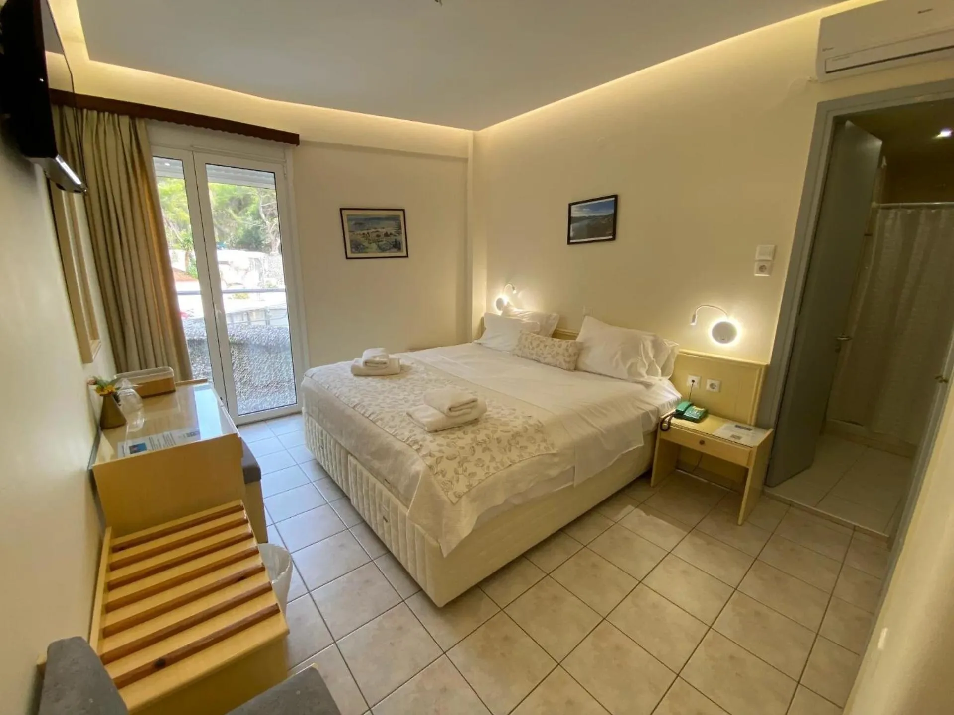 Bed in New Aegli Resort Hotel