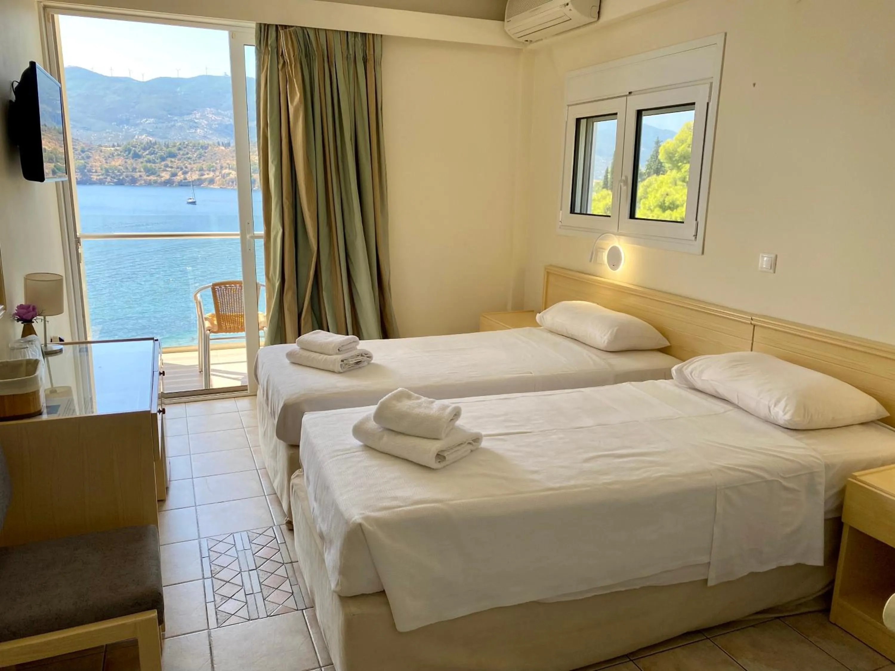 Bed in New Aegli Resort Hotel