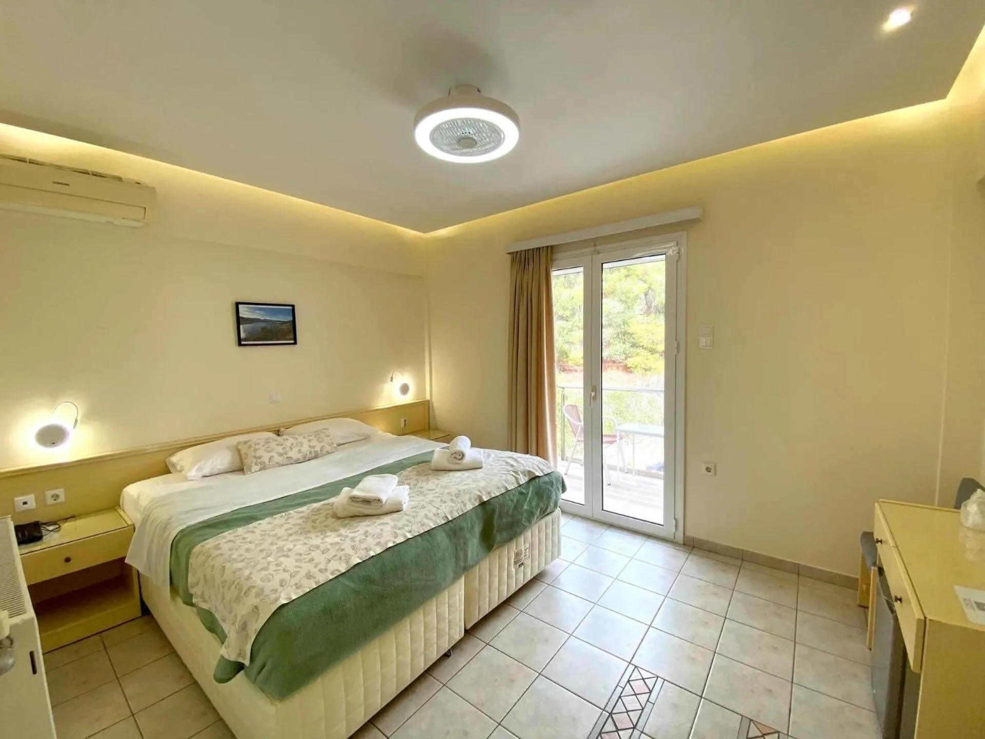 Bed in New Aegli Resort Hotel