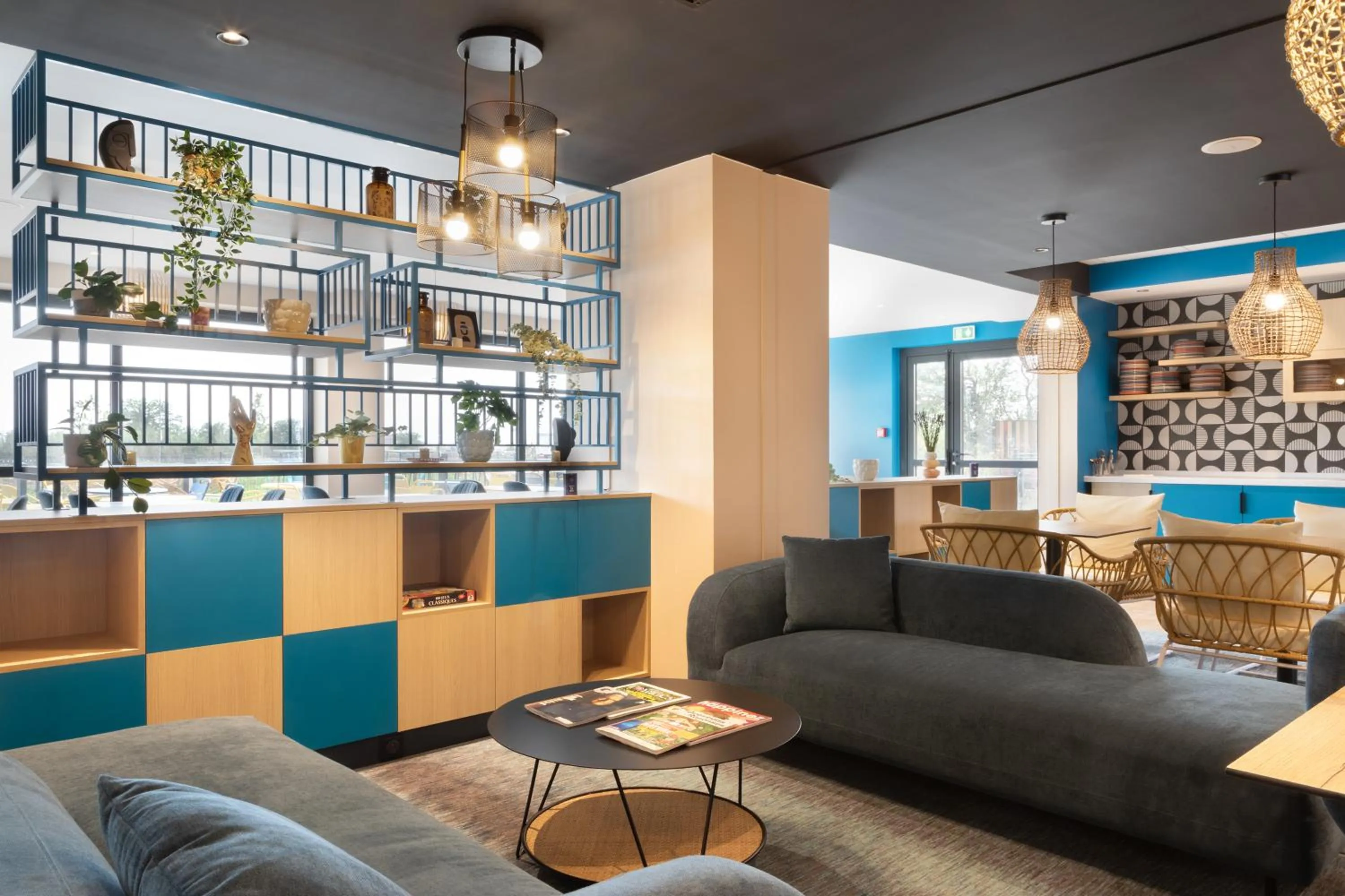 Communal lounge/ TV room in Ibis Styles Miramas