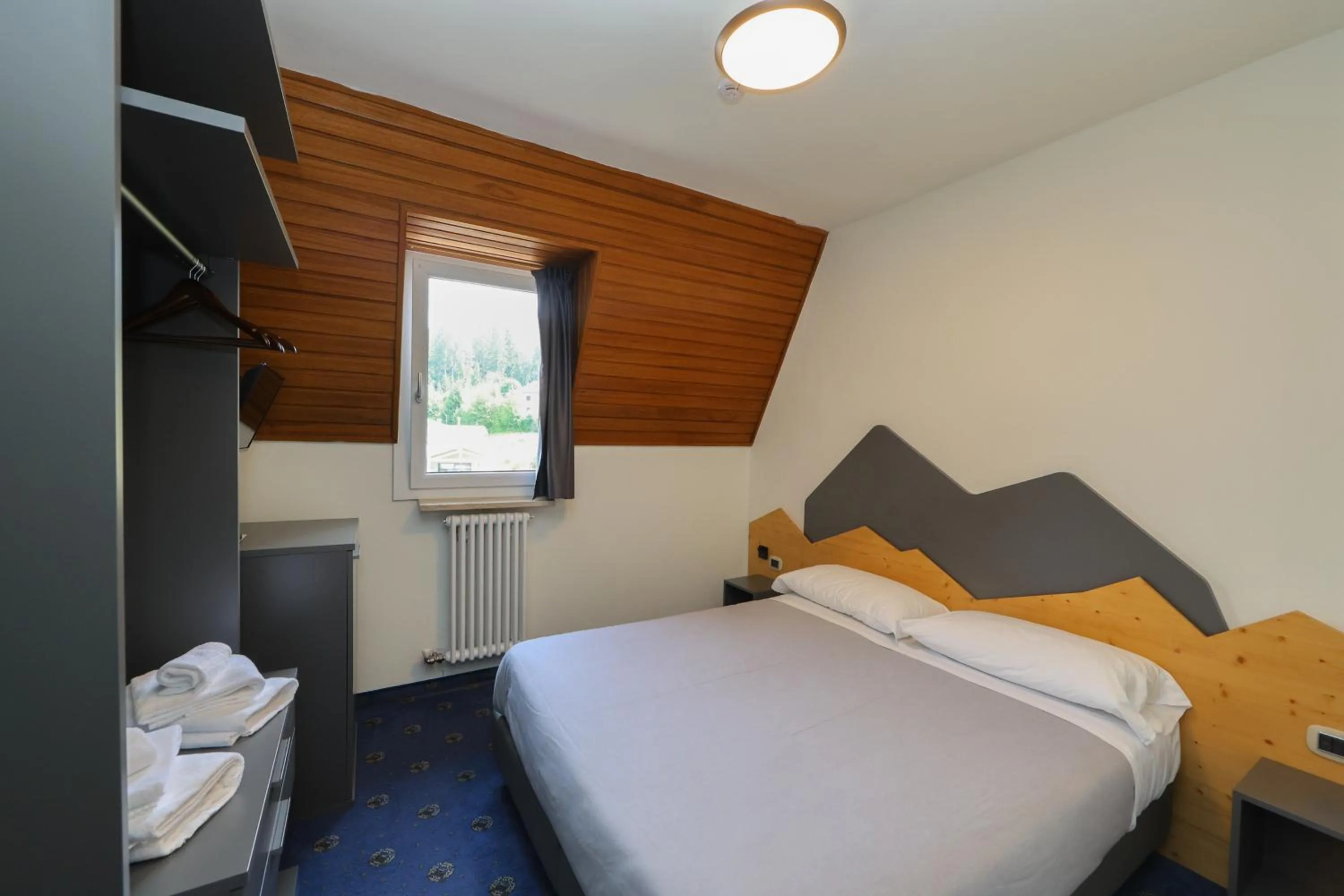 Bed in Hotel Regina del Bosco