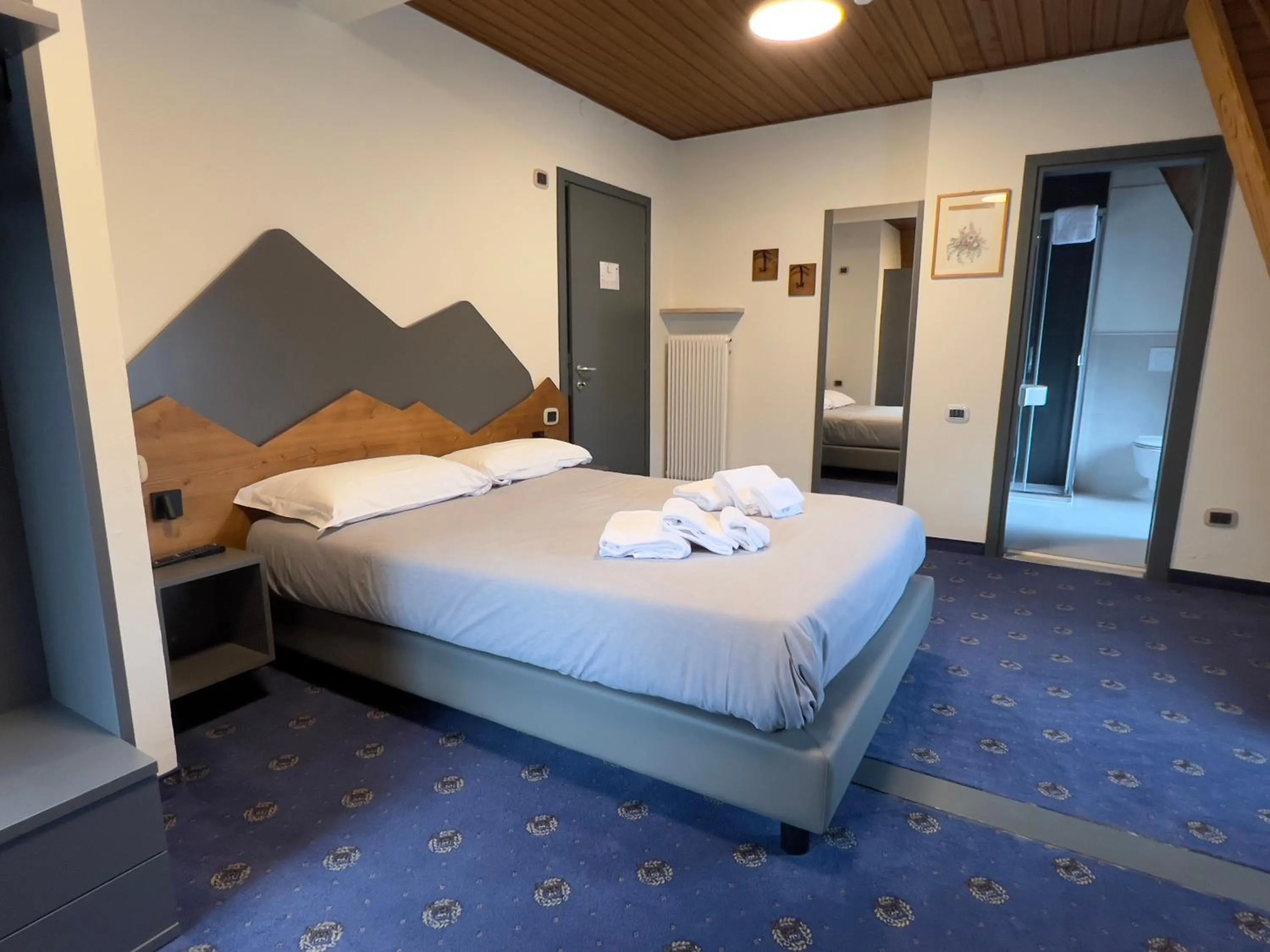 Bed in Hotel Regina del Bosco