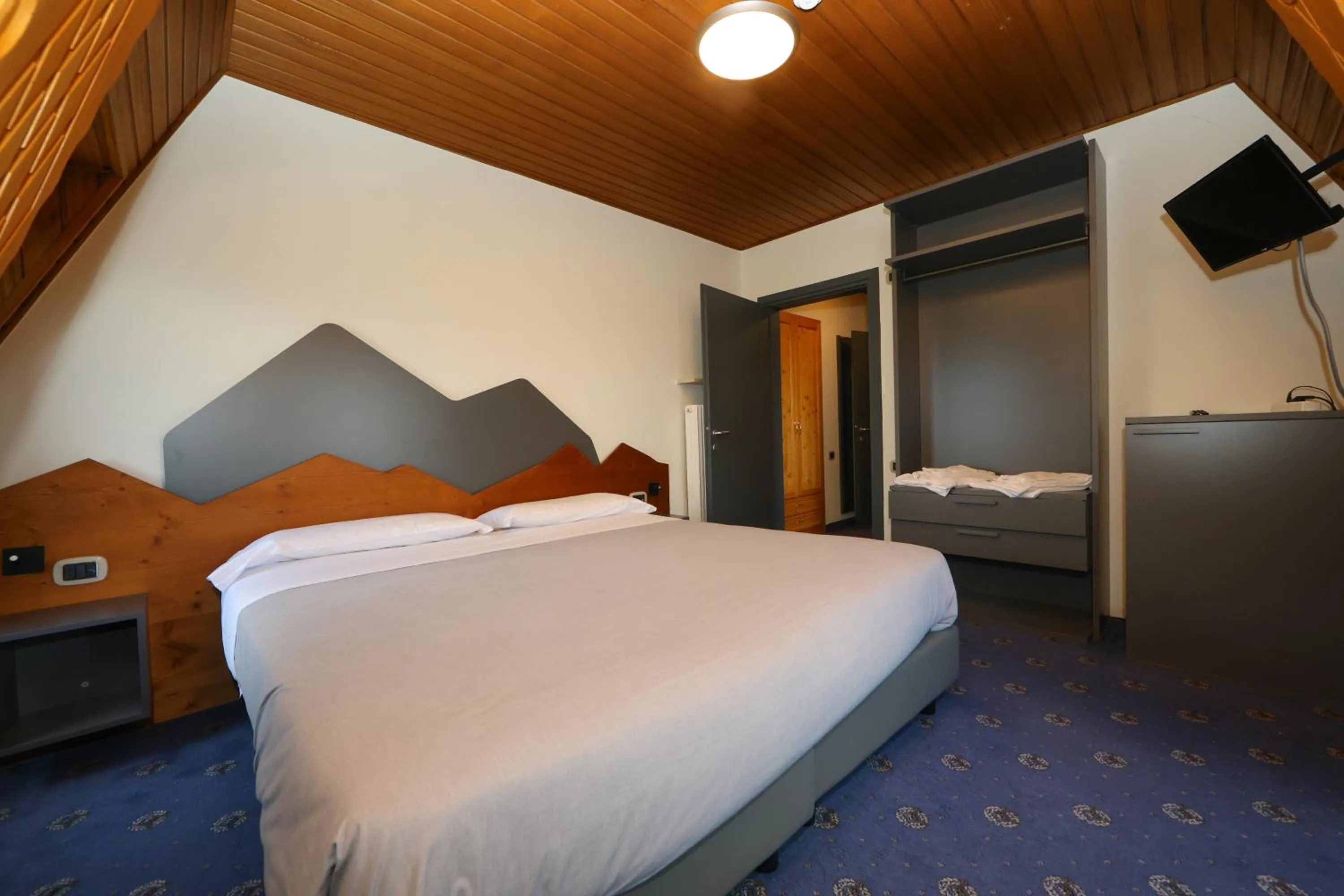 Bed in Hotel Regina del Bosco