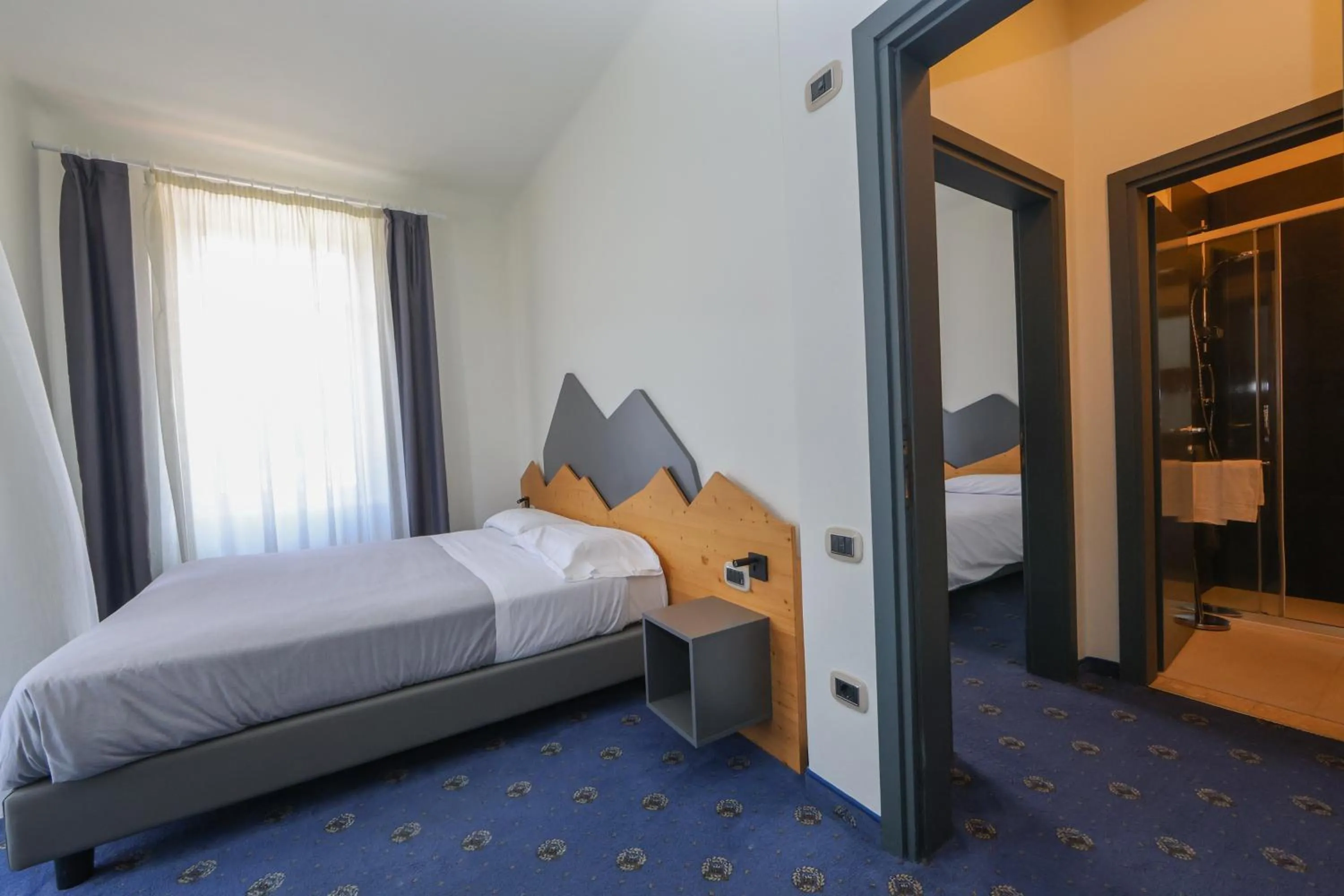 Bed in Hotel Regina del Bosco