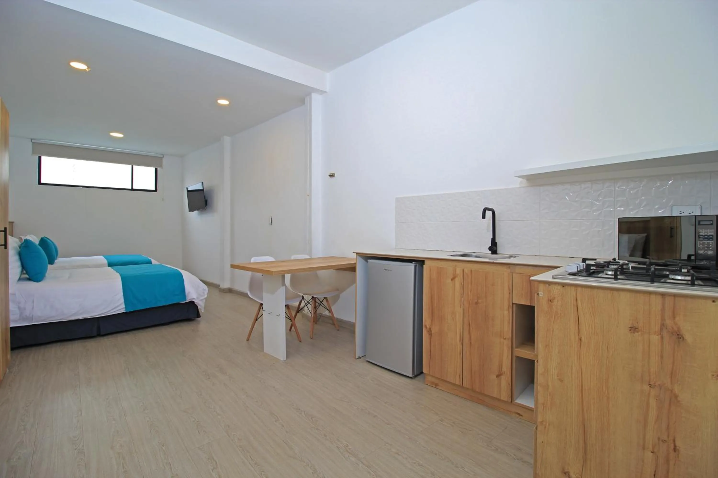 Bed in Apart Hotel Casa Blanca