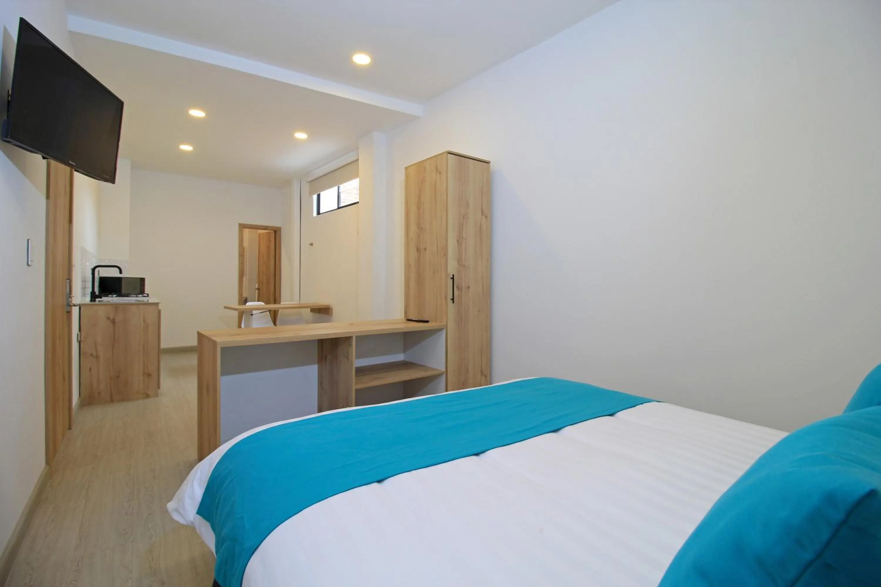 Bed in Apart Hotel Casa Blanca