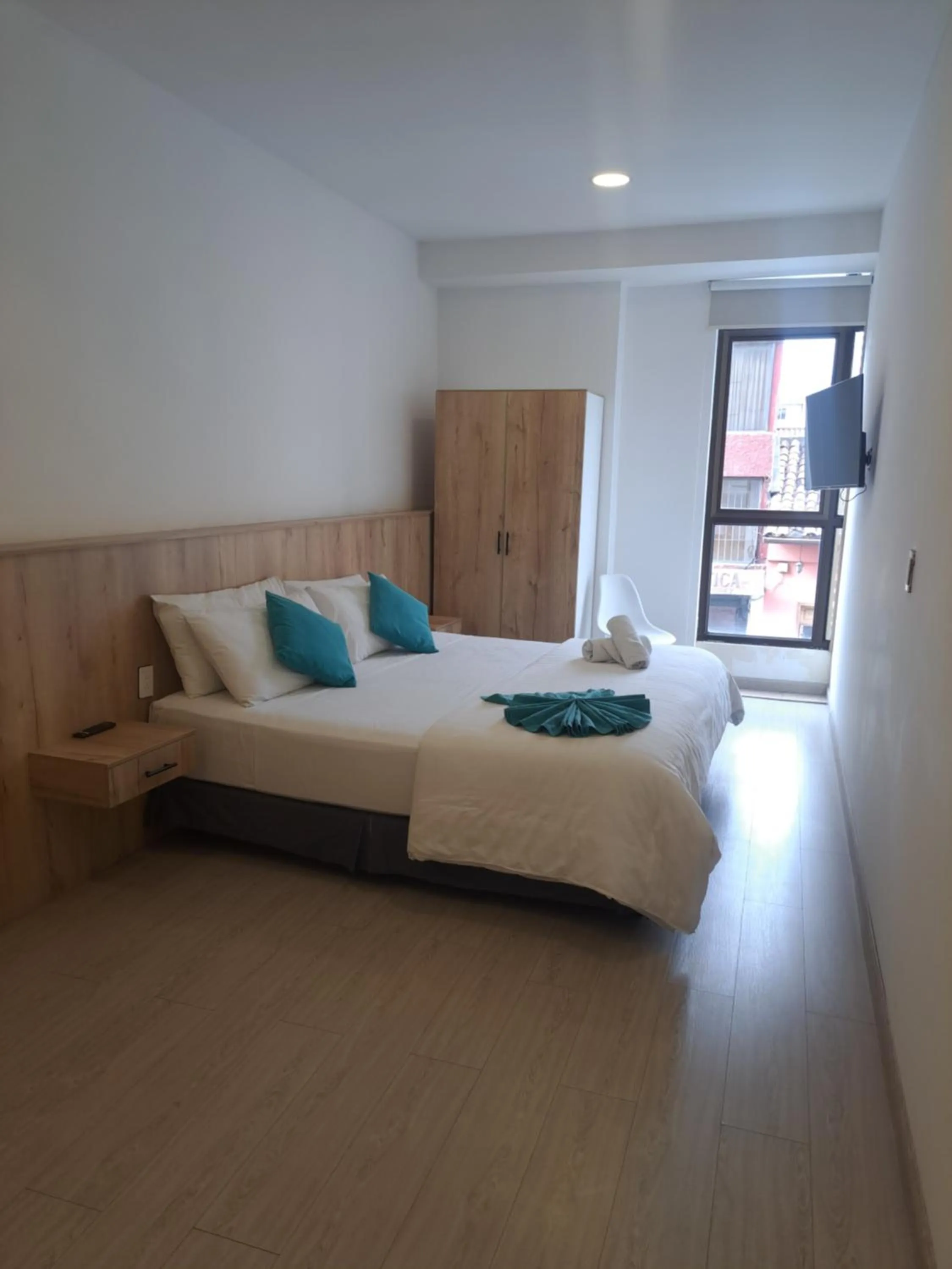 Bed in Apart Hotel Casa Blanca