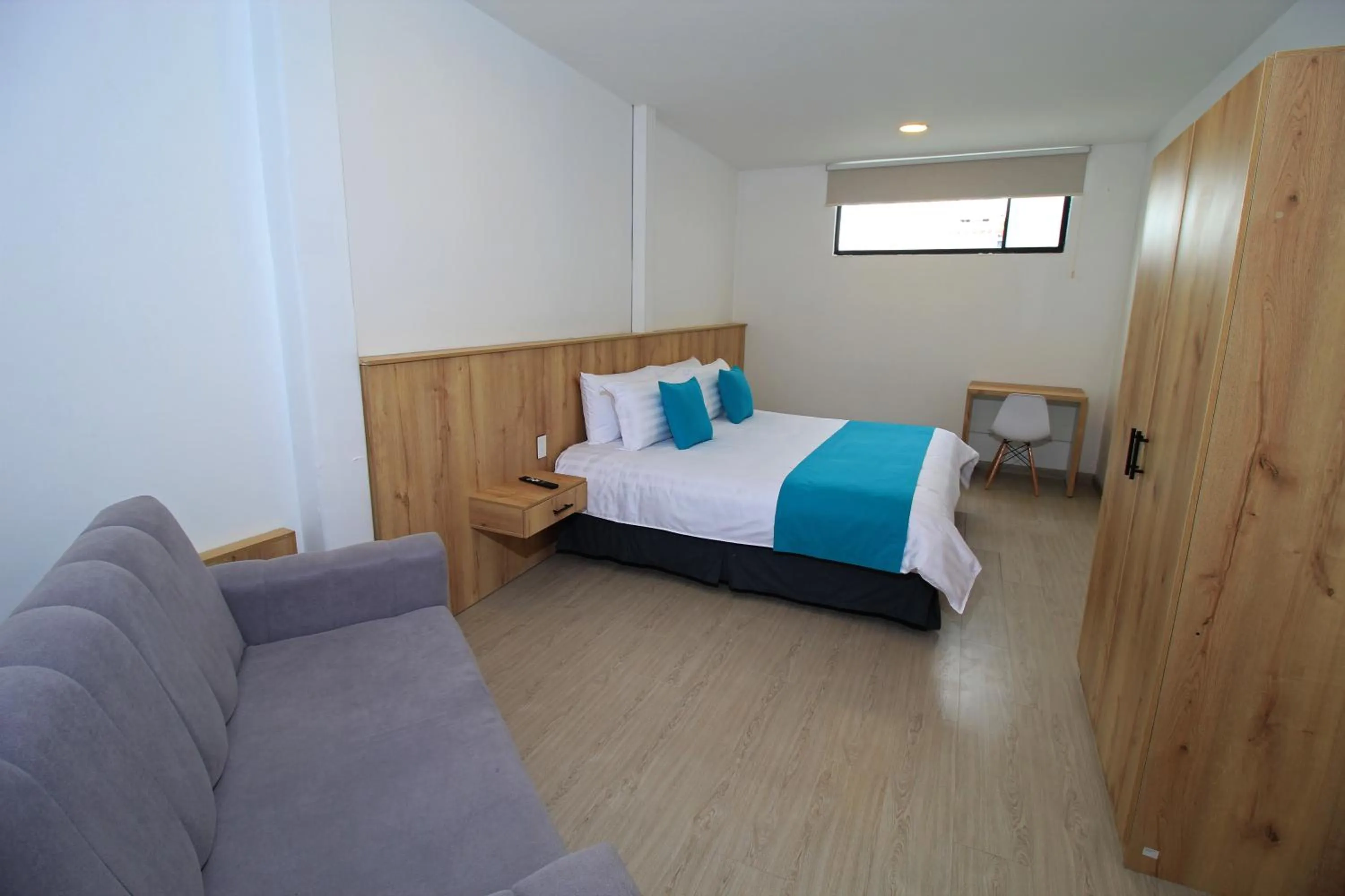 Bed in Apart Hotel Casa Blanca