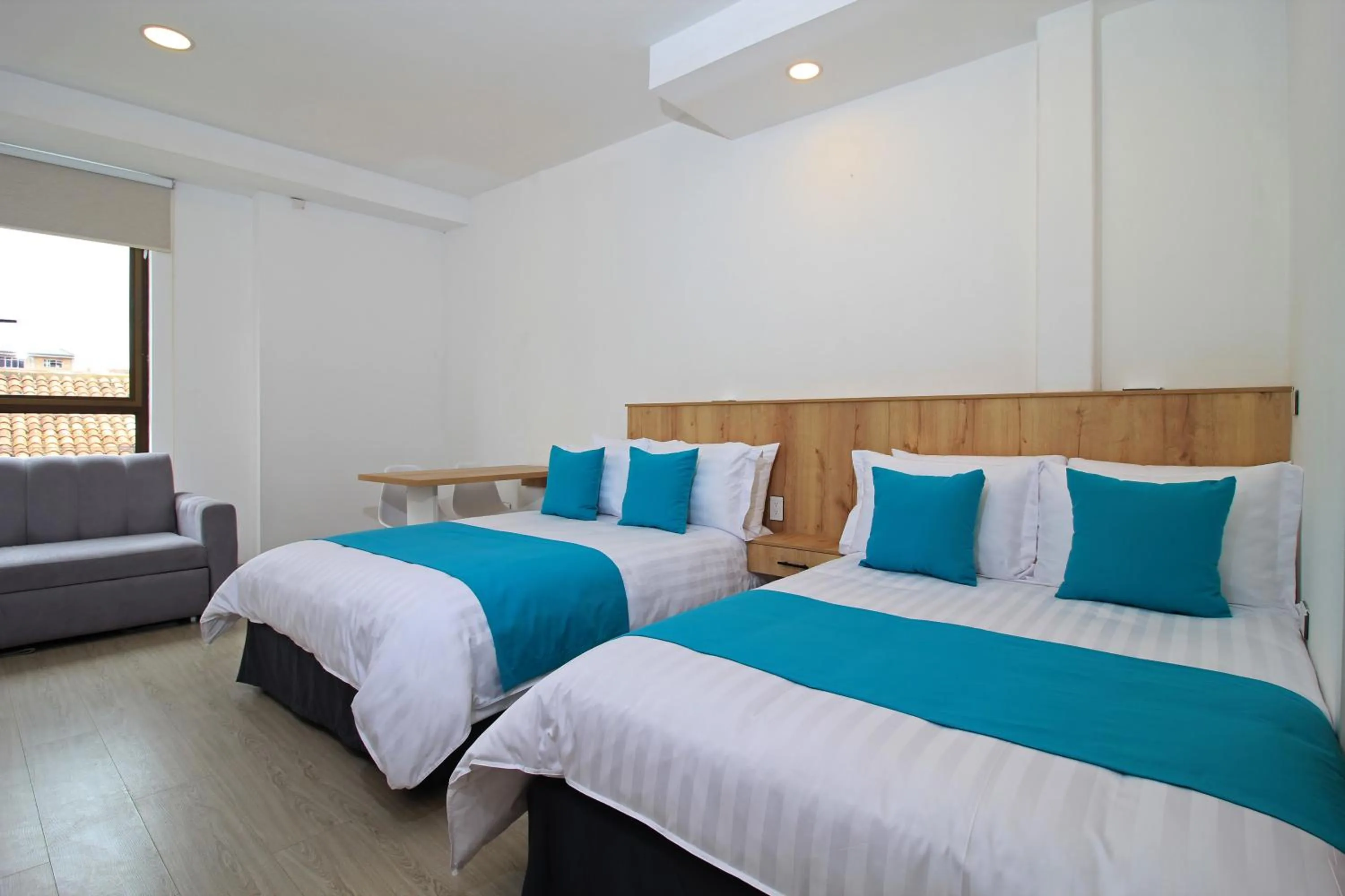 Bed in Apart Hotel Casa Blanca