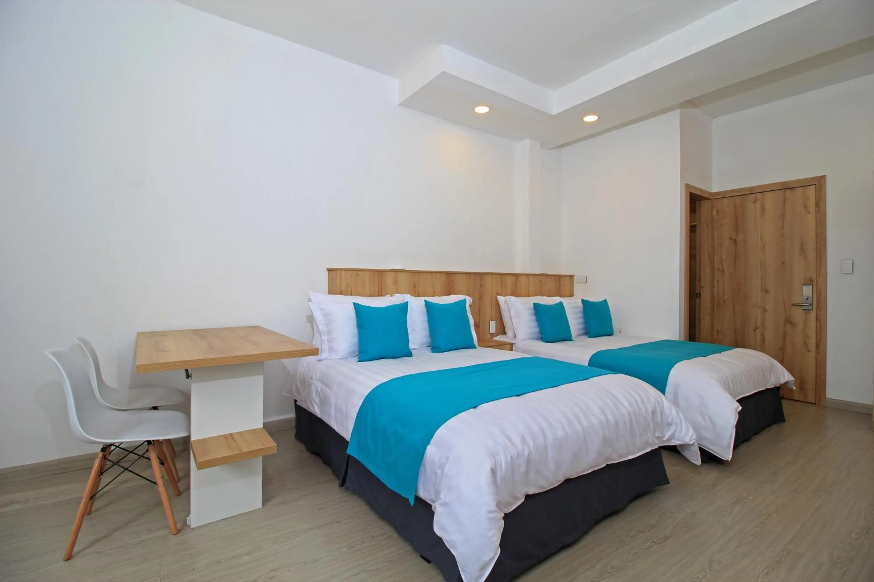 Bed in Apart Hotel Casa Blanca