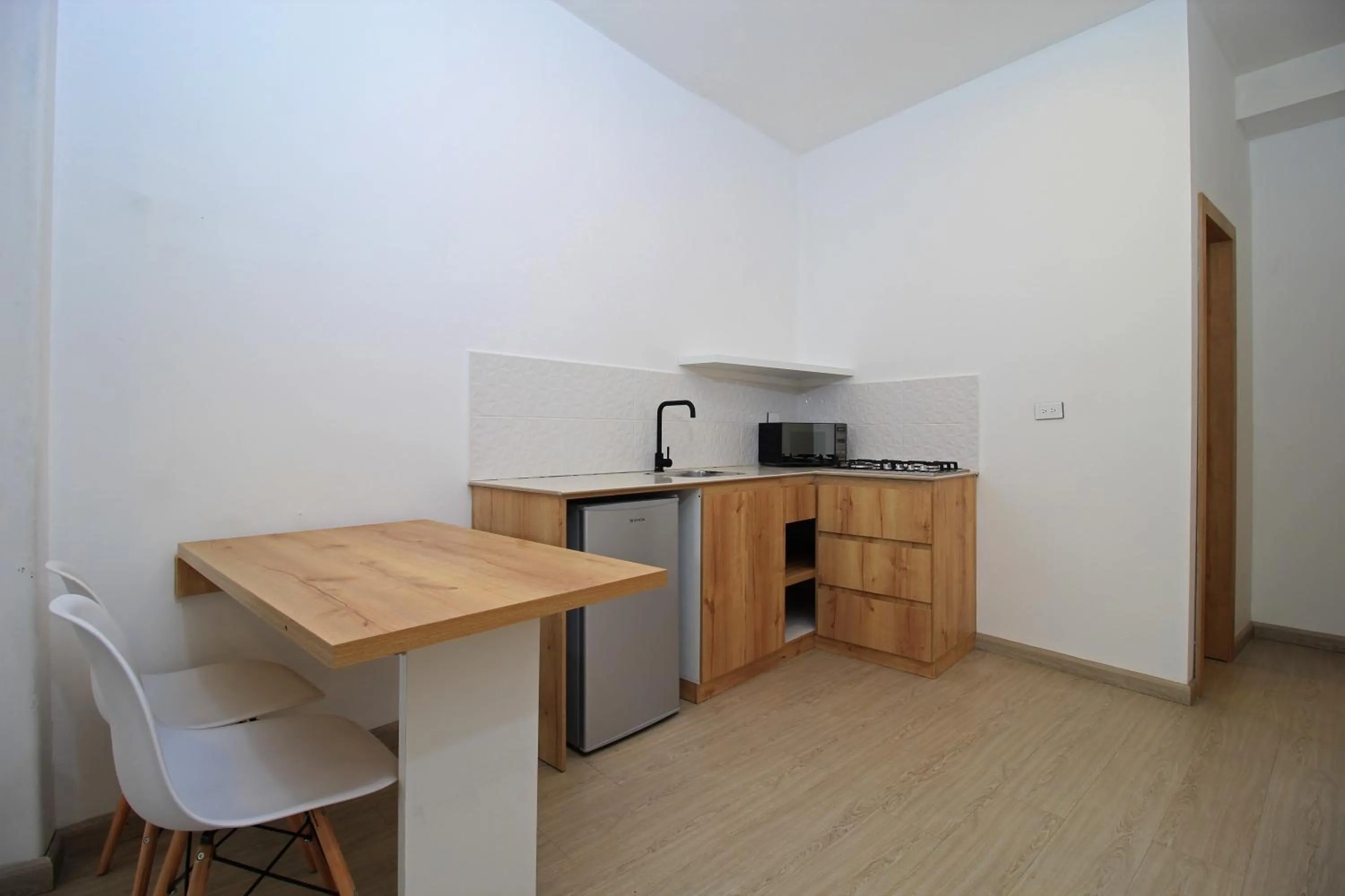 Kitchen or kitchenette in Apart Hotel Casa Blanca