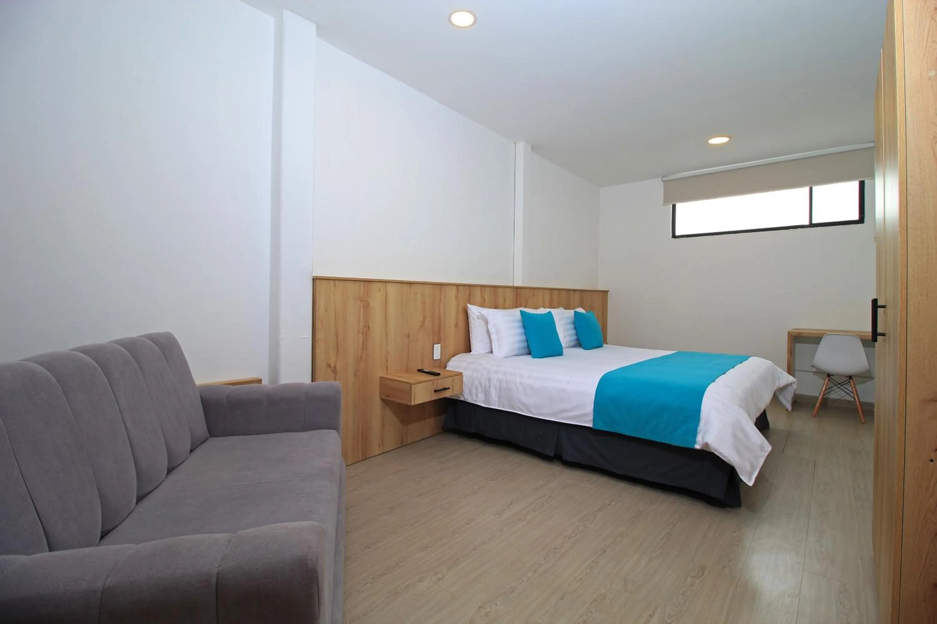 Bed in Apart Hotel Casa Blanca