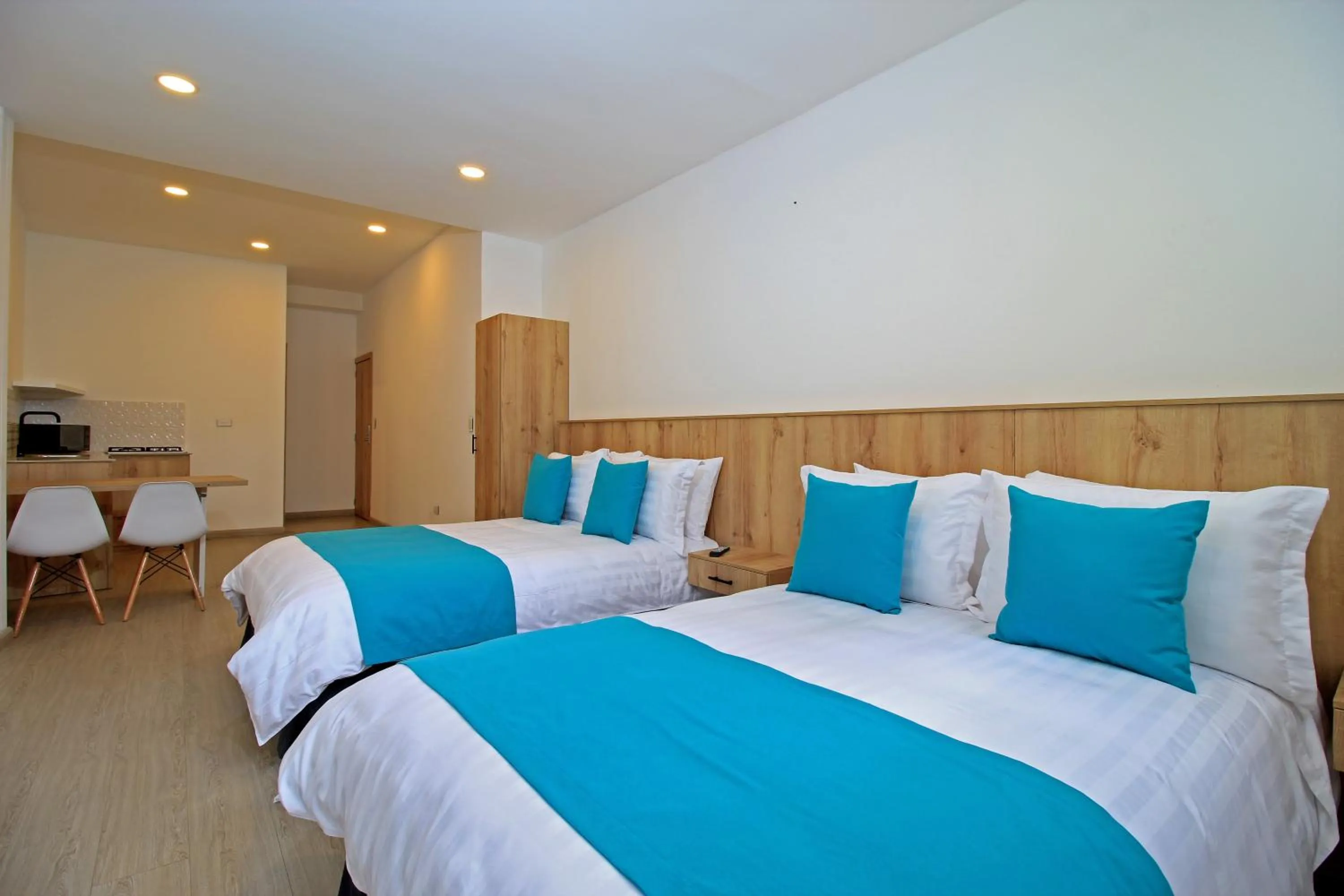 Bed in Apart Hotel Casa Blanca