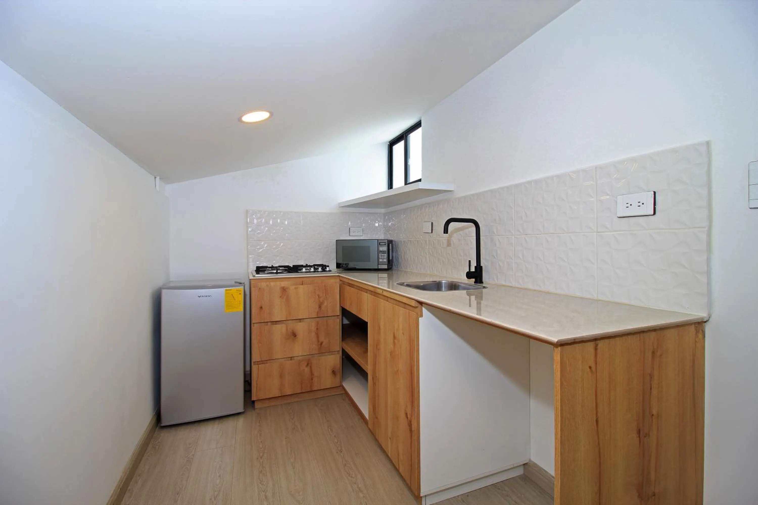 Kitchen or kitchenette in Apart Hotel Casa Blanca