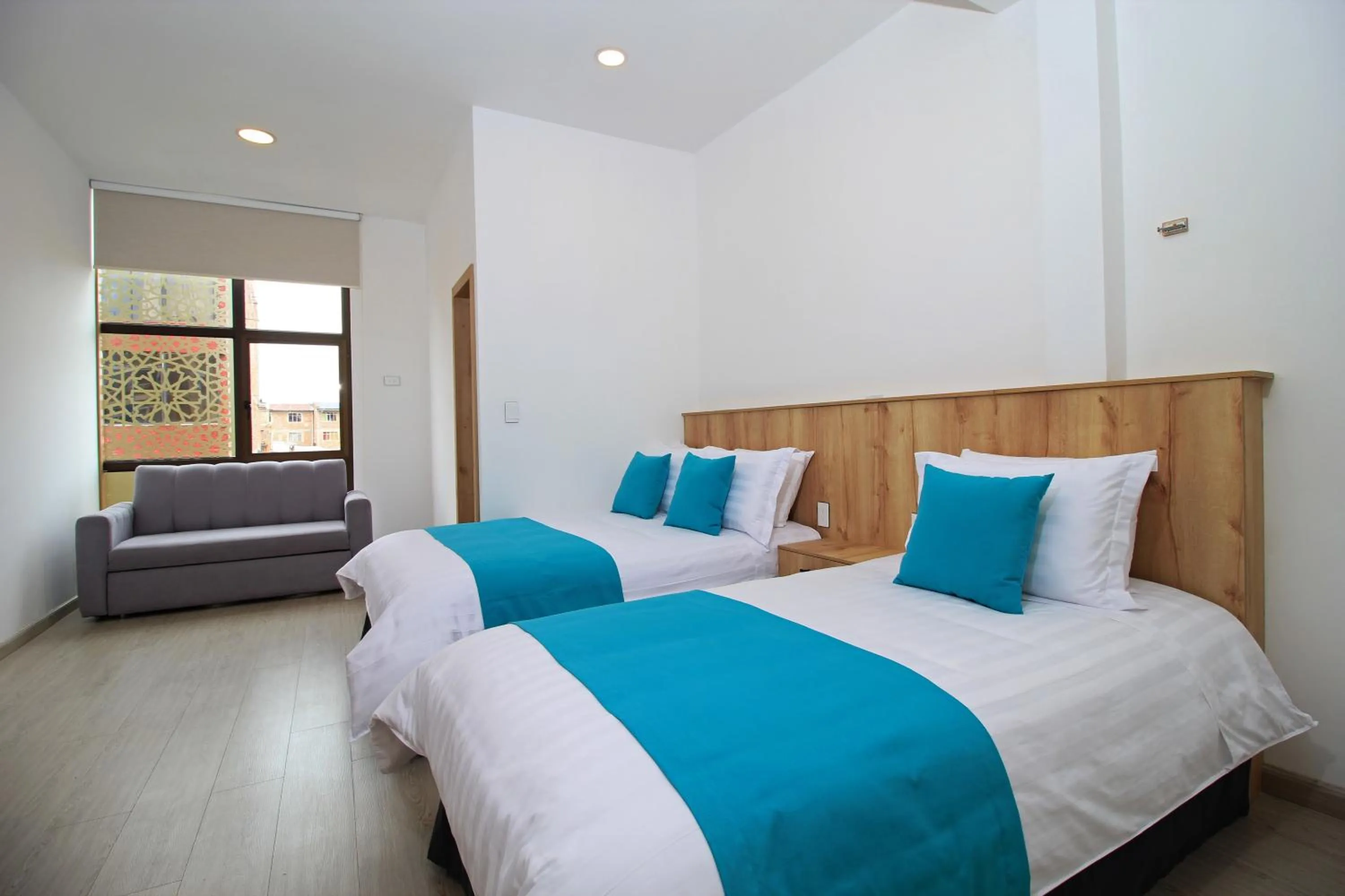 Bed in Apart Hotel Casa Blanca