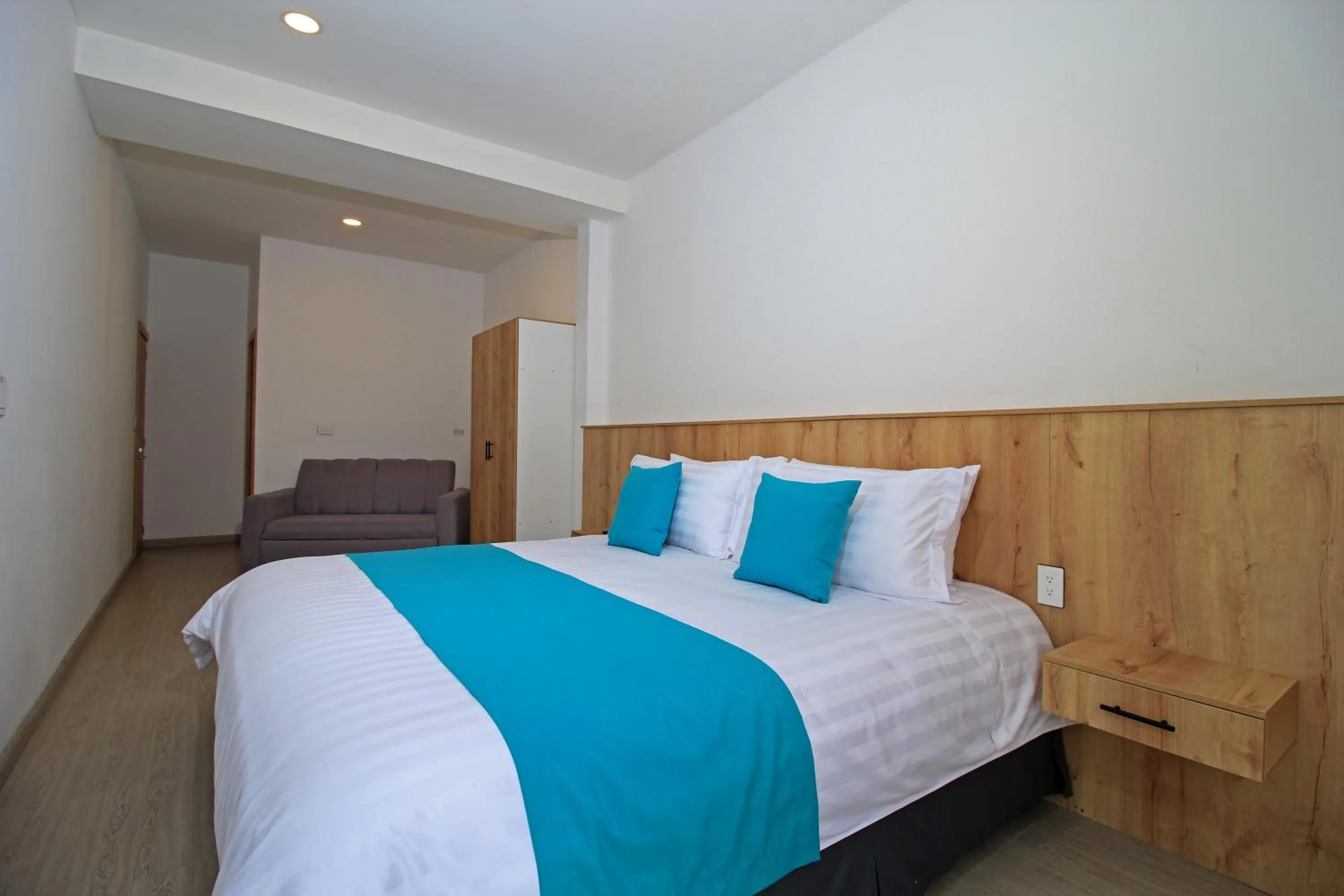 Bed in Apart Hotel Casa Blanca