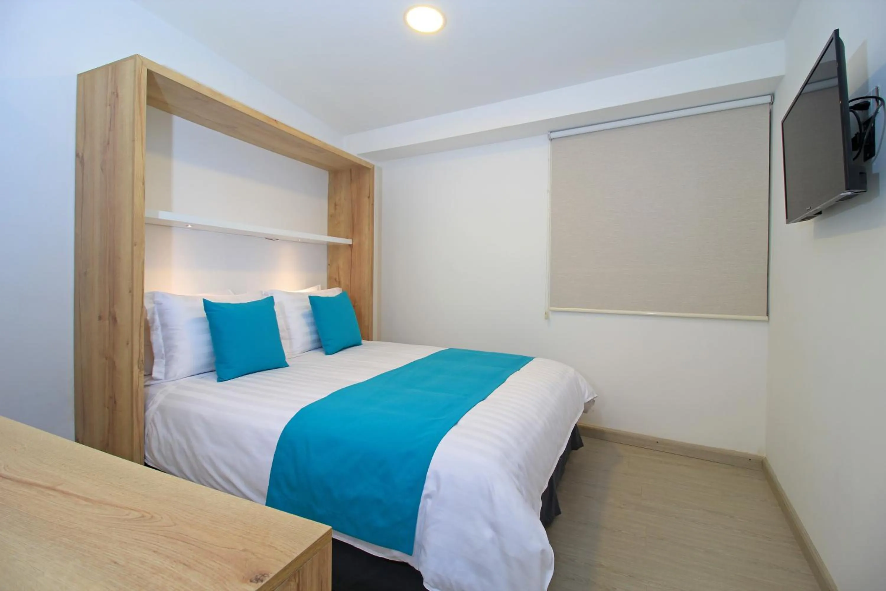 Bed in Apart Hotel Casa Blanca